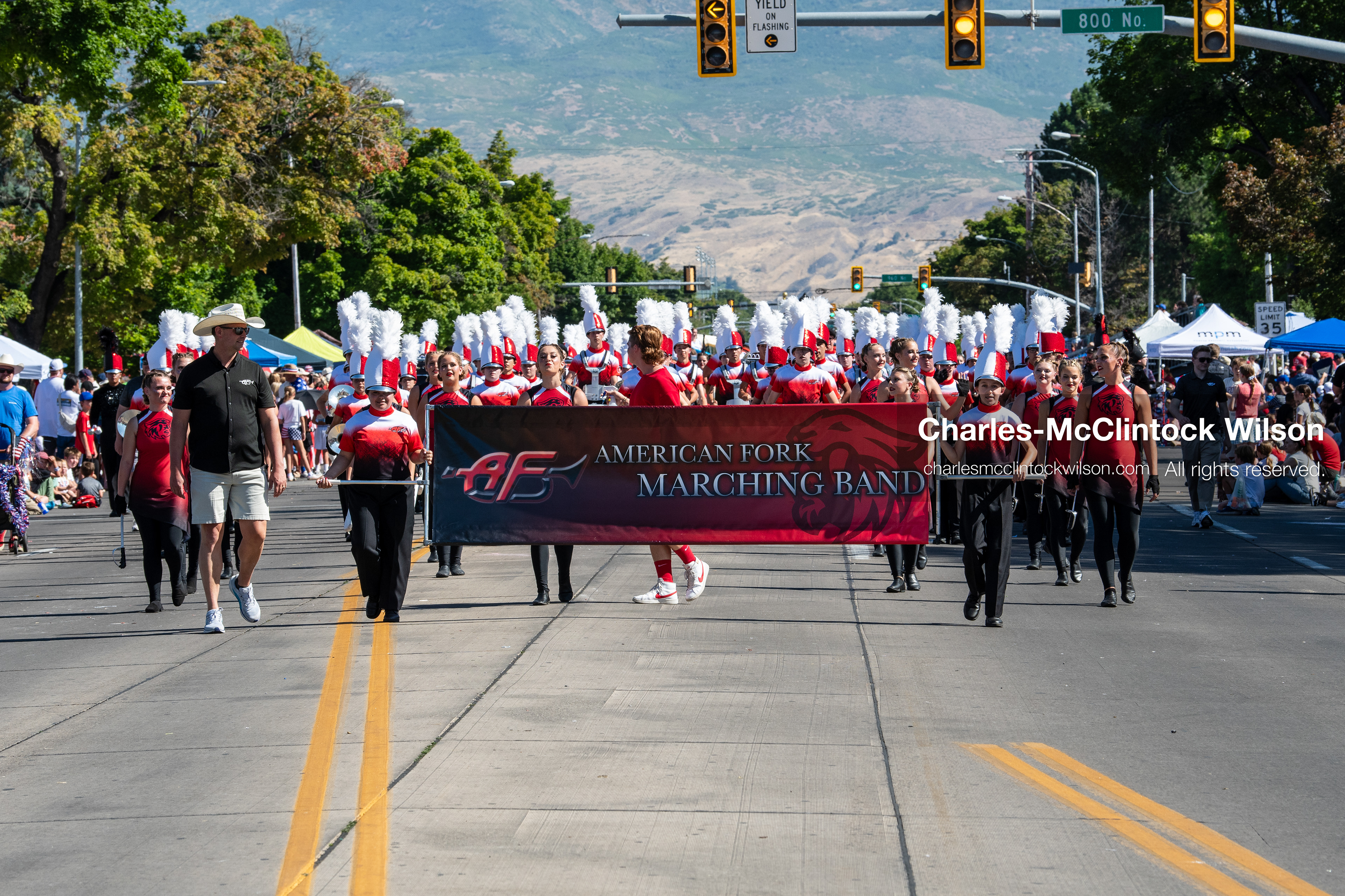 July 4, 2026, Provo, Utah, USA: Members of a high school marching band dressed in maroon and black uniforms play brass instruments while marching down the street during America's Freedom Festival Grand Parade in Provo, Utah, Saturday, July 4, 2026. The annual Independence Day event features expanded programming to honor the 250th anniversary of United States independence. (Credit Image: © Charles-McClintock Wilson/ZUMA Press Wire)