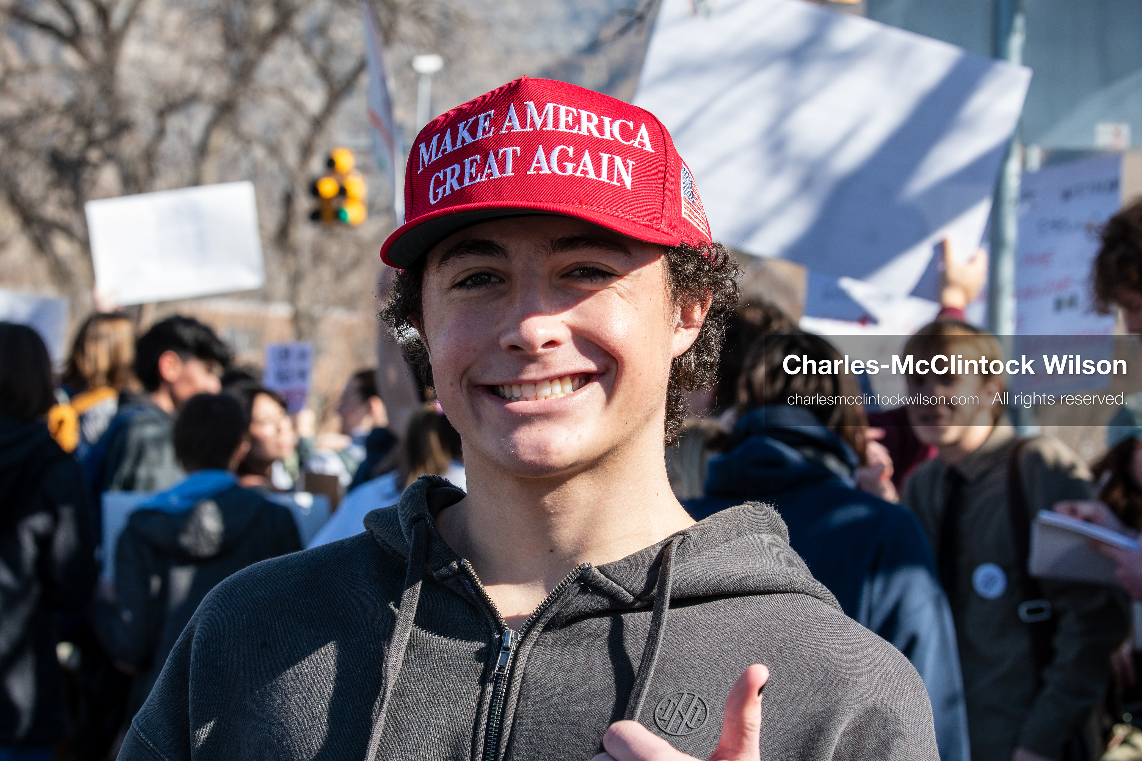  February 5, 2026, Provo, Utah, USA: A young person wearing a red Make America Great Again hat stands among demonstrators near Brigham Young University in Provo during a gathering opposing the presence of US Customs and Border Protection recruiters at a career fair held on the BYU campus. (Credit Image: © Charles McClintock Wilson/ZUMA Press Wire)