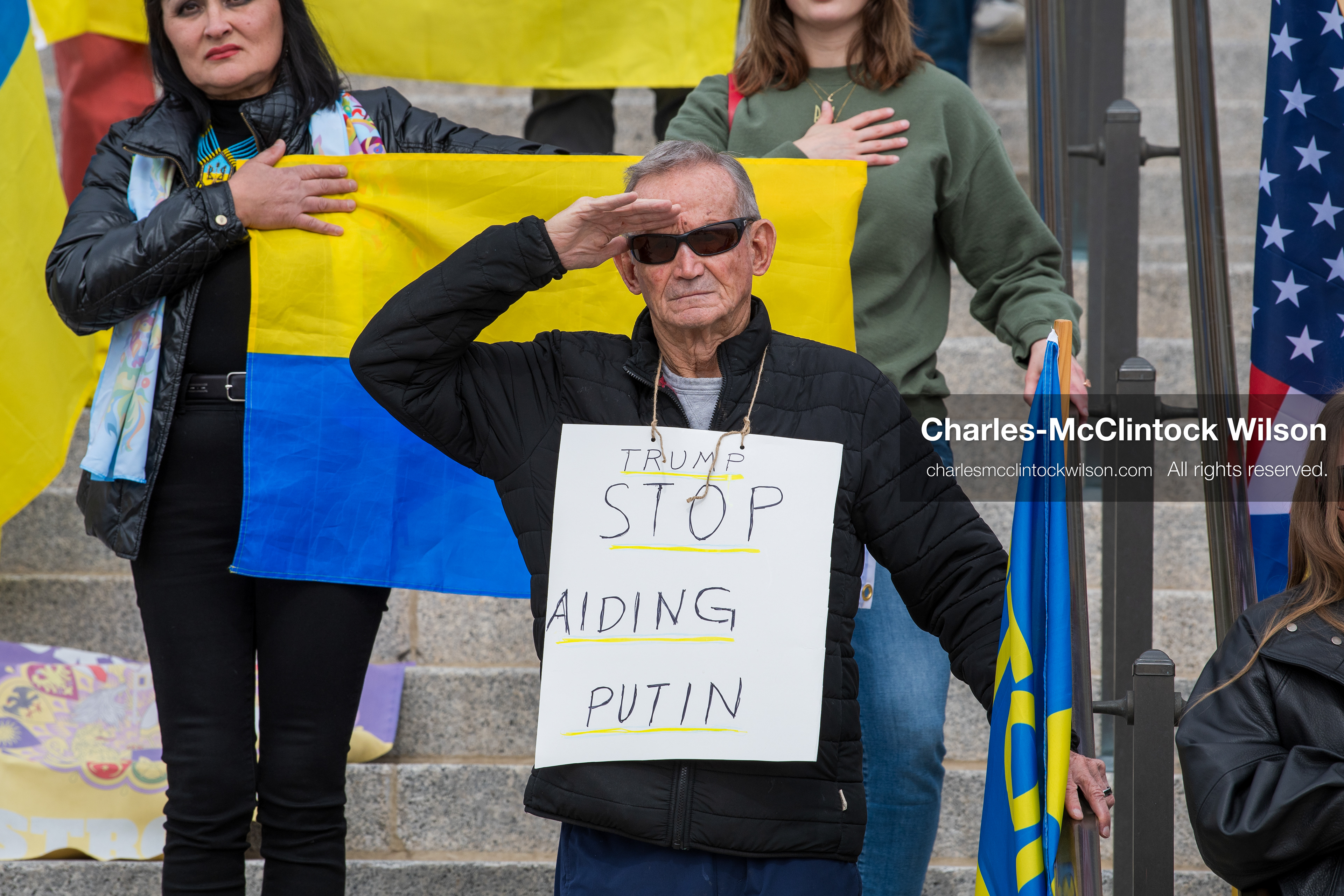 February 28, 2026, Salt Lake City, Utah, USA: Demonstrators gather on the steps near the Utah State Capitol during the Stand With Ukraine rally, holding American and Ukrainian flags along with a sign reading Peace With Honor Equals Victory vs Tyranny Support Ukraine. The gathering marked the four year anniversary of the full scale Russian invasion of Ukraine and brought community members together in support of Ukrainians and local humanitarian efforts. (Credit Image: © Charles McClintock Wilson/ZUMA Press Wire)