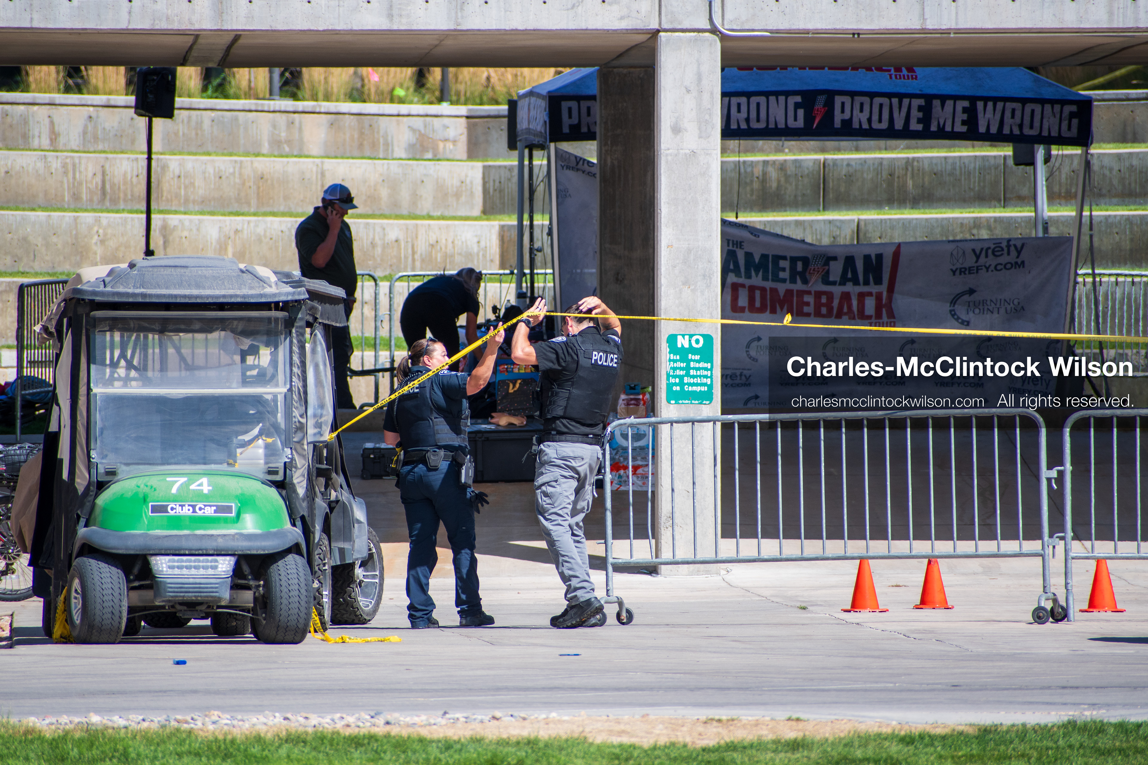 September 12, 2025, Orem, Utah, USA: Investigators and police officers secure the canopy-covered courtyard at Utah Valley University in Orem, Utah, where conservative activist CHARLIE KIRK was fatally shot during a public speaking event on September 10, 2025. KIRK, CEO of Turning Point USA, was seated beneath the canopy when a single bullet struck him in the neck.   (Credit Image: © Charles‑McClintock Wilson/ZUMA Press Wire)