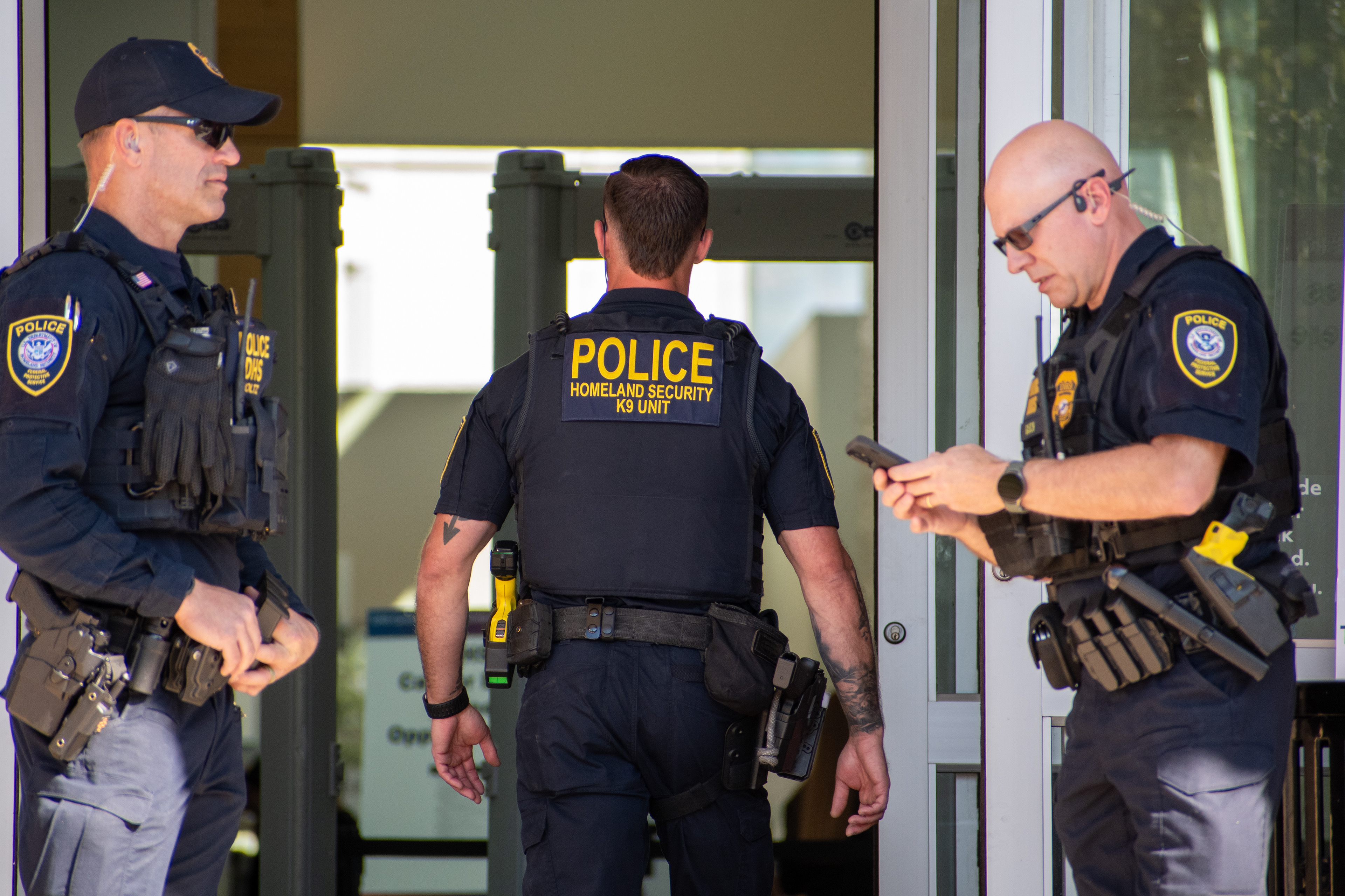 September 15, 2025 – Provo, Utah, United States: Homeland Security police officers stand near the entrance of the Utah Valley Convention Center during a Department of Homeland Security career expo focused on recruiting law enforcement and security personnel. Photograph by Charles‑McClintock Wilson / ZUMA Press Wire