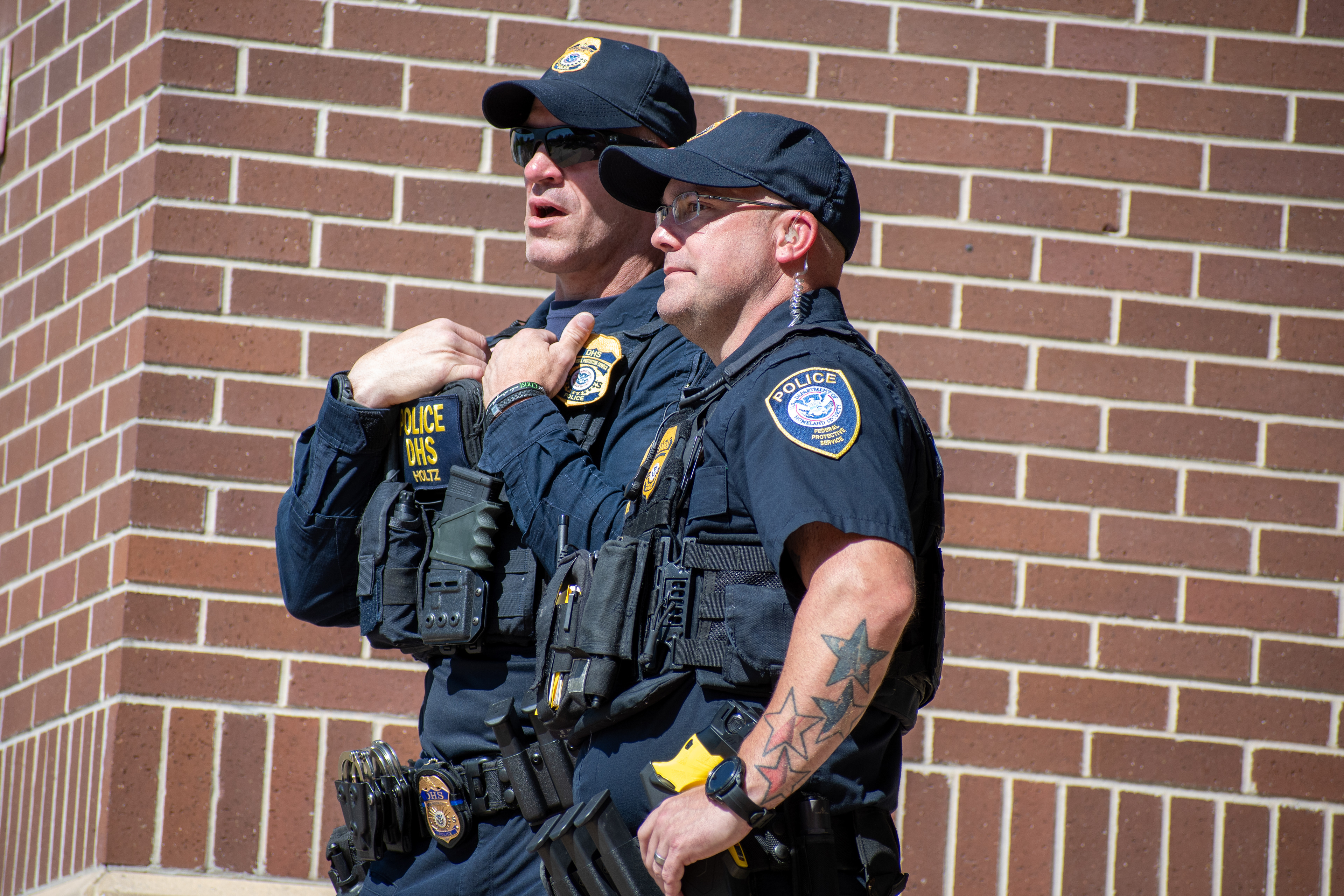 September 15, 2025 – Provo, Utah, United States: Two Homeland Security police officers speak outside the Utah Valley Convention Center during a Department of Homeland Security career expo, part of a national recruitment initiative offering federal law enforcement and security positions. Photograph by Charles‑McClintock Wilson / ZUMA Press Wire
