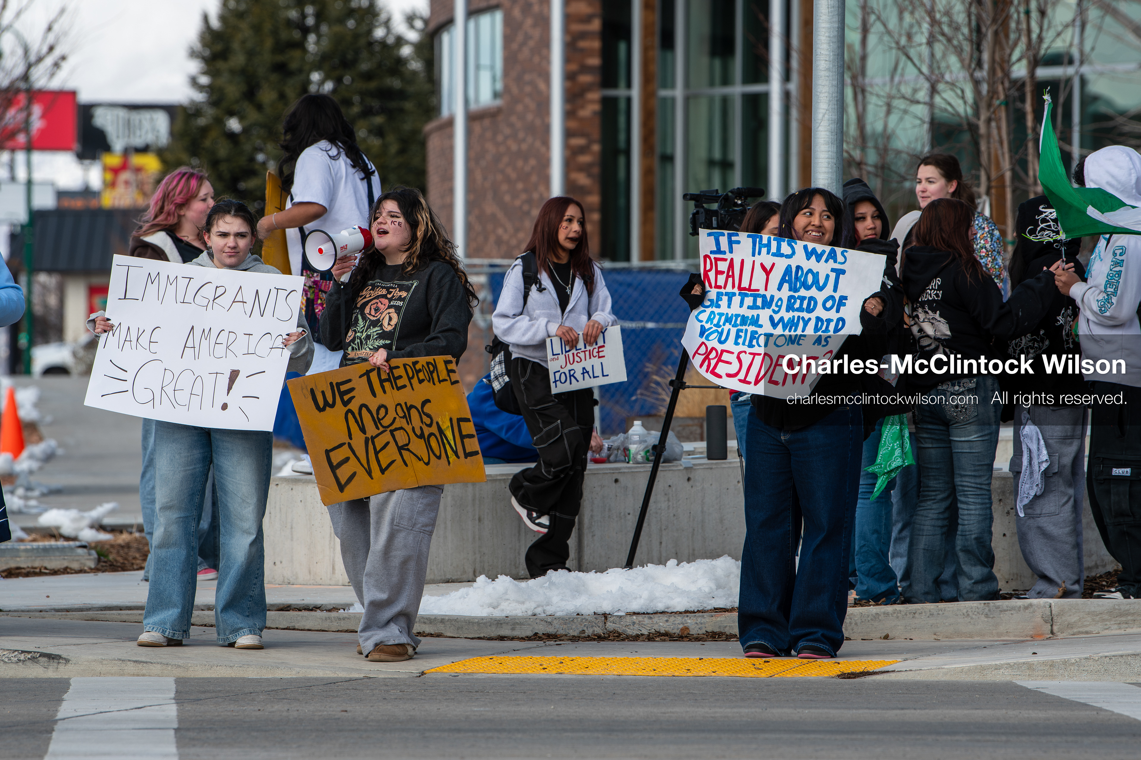 February 20, 2026, Orem, Utah, USA: High school students gather along State Street in front of Orem City Hall during a student led protest against ICE and federal immigration enforcement. Demonstrators hold signs as they stand near the roadway while traffic continues through the area. (Credit Image: © Charles McClintock Wilson/ZUMA Press Wire)