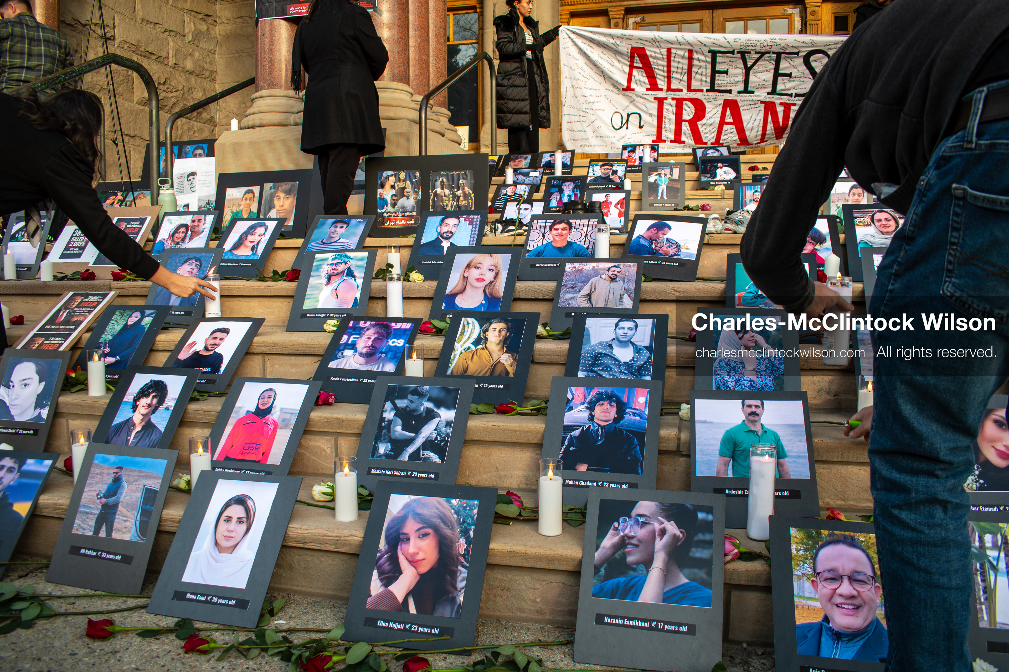 January 30, 2026, Salt Lake City, Utah, USA: People gather around portraits, candles, and flowers arranged on the steps of the Salt Lake City and County Building during a vigil honoring victims of the Iranian government. (Credit Image: © Charles McClintock Wilson/ZUMA Press Wire)