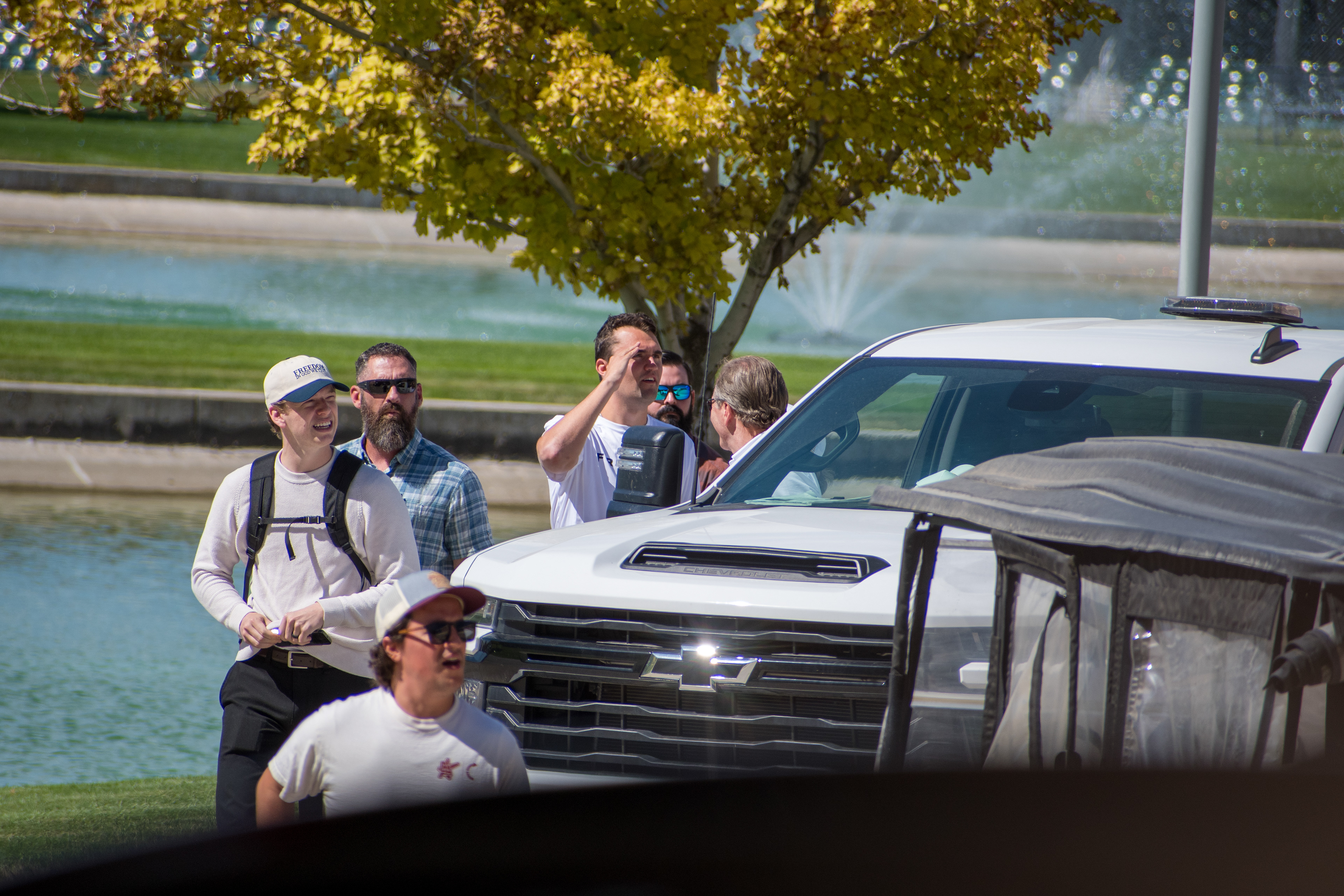 OREM, UTAH – SEPTEMBER 10, 2025: Charlie Kirk arrives at Utah Valley University for a scheduled public event. Walking near a water feature and surrounded by staff and supporters, Kirk enters the venue in a moment of calm anticipation. The image marks the beginning of his final public appearance, reflecting the quiet buildup before the crowd engagement that followed. © Charles-McClintock Wilson / ZUMA Press