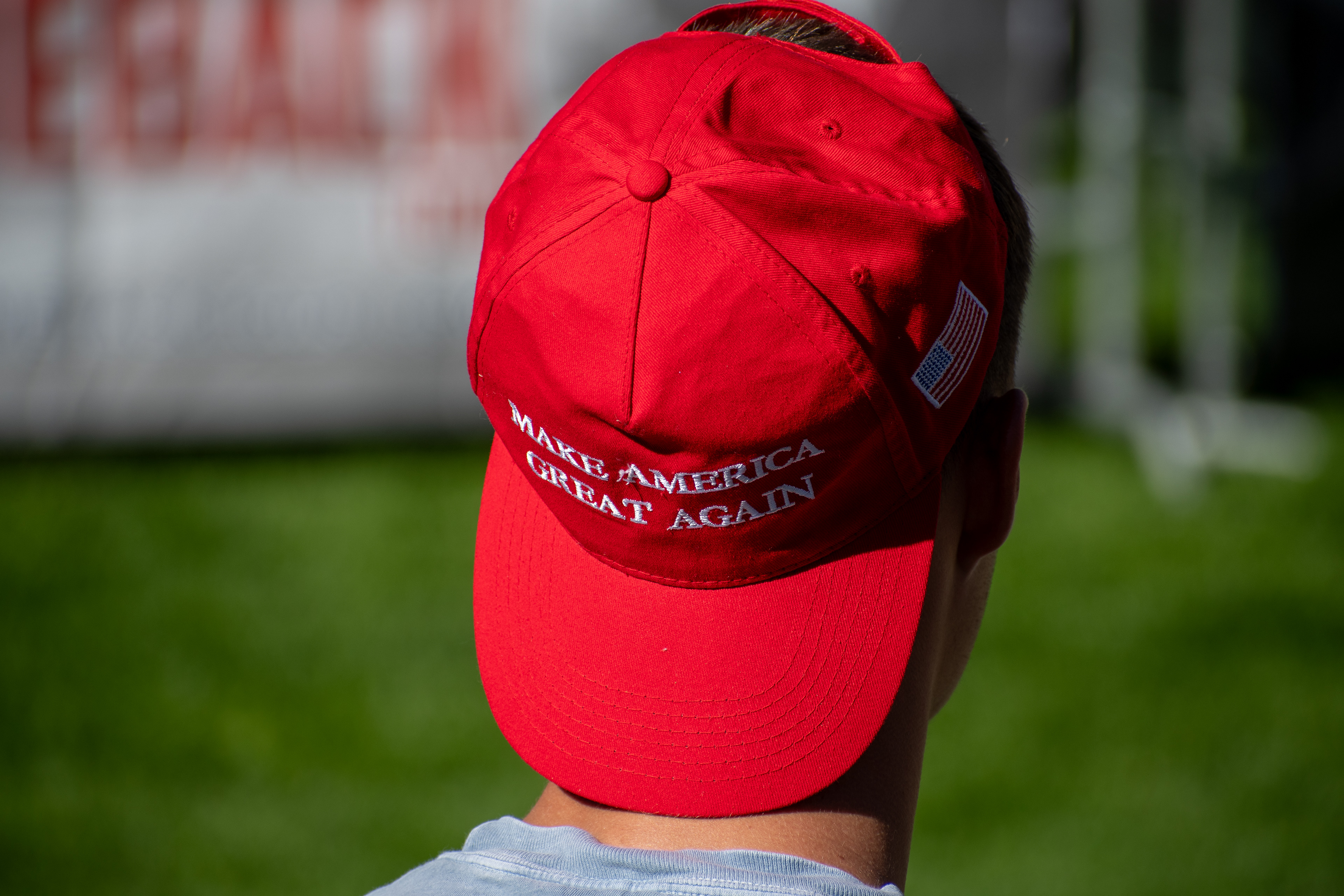 OREM, UTAH – SEPTEMBER 10, 2025: An attendee stands quietly on the lawn at Utah Valley University during the opening stop of the American Comeback Tour. Framed from behind, the image captures a moment of stillness and personal presence amid the larger gathering. It reflects the emotional texture and civic anticipation that shaped the event’s intended spirit. © Charles-McClintock Wilson / ZUMA Press
