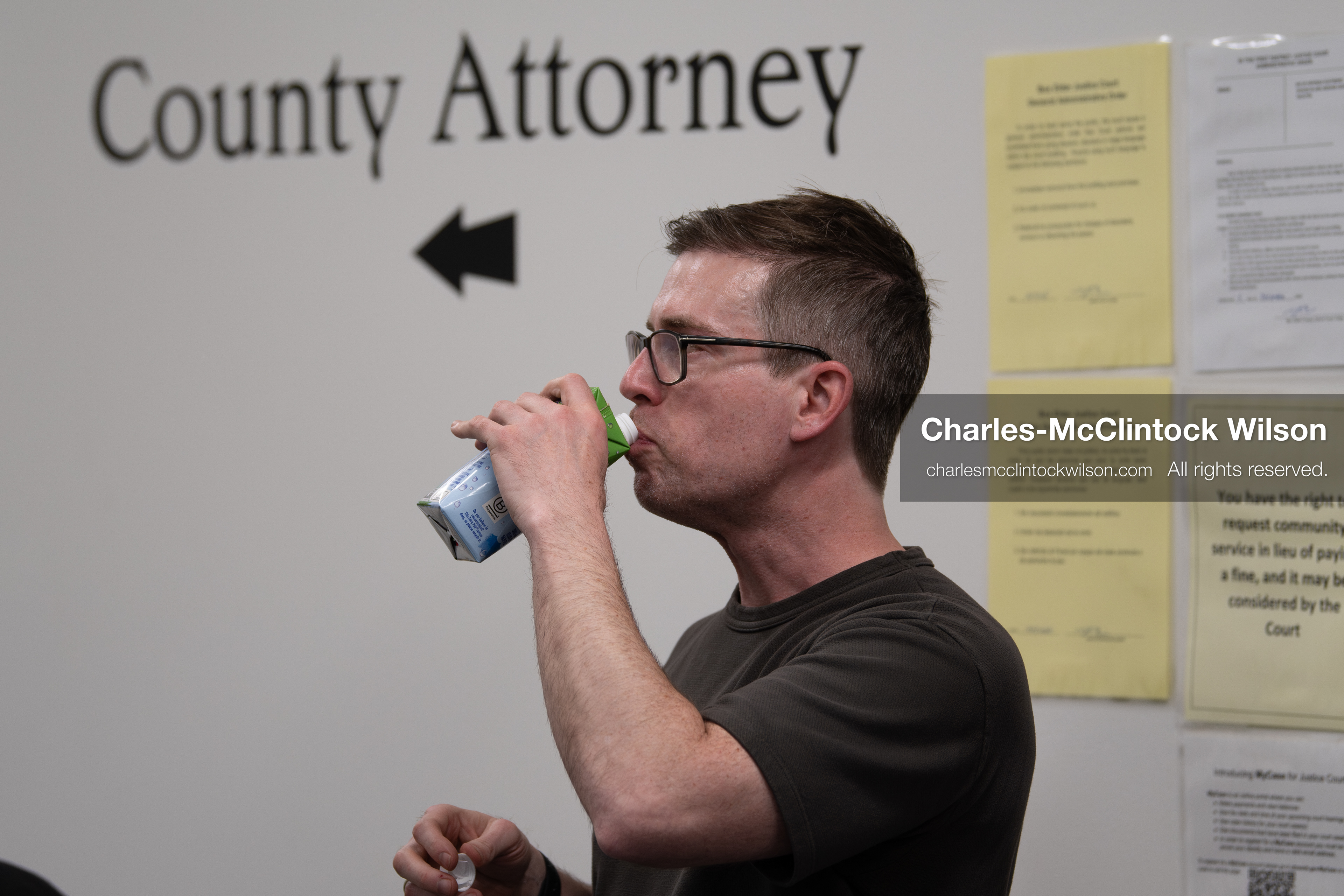 May 13, 2026, Brigham City, Utah, USA: US political satirist and digital creator WALTER MASTERSON drinks from a boxed beverage that appears to be coconut water inside the Box Elder County Justice Courthouse in Brigham City, Utah, on May 13, 2026, during coverage of a gathering over the proposed data center project backed by businessman Kevin O'Leary, which has drawn public concern over water use, power demand, and transparency. (Credit Image: © Charles-McClintock Wilson/ZUMA Press Wire)