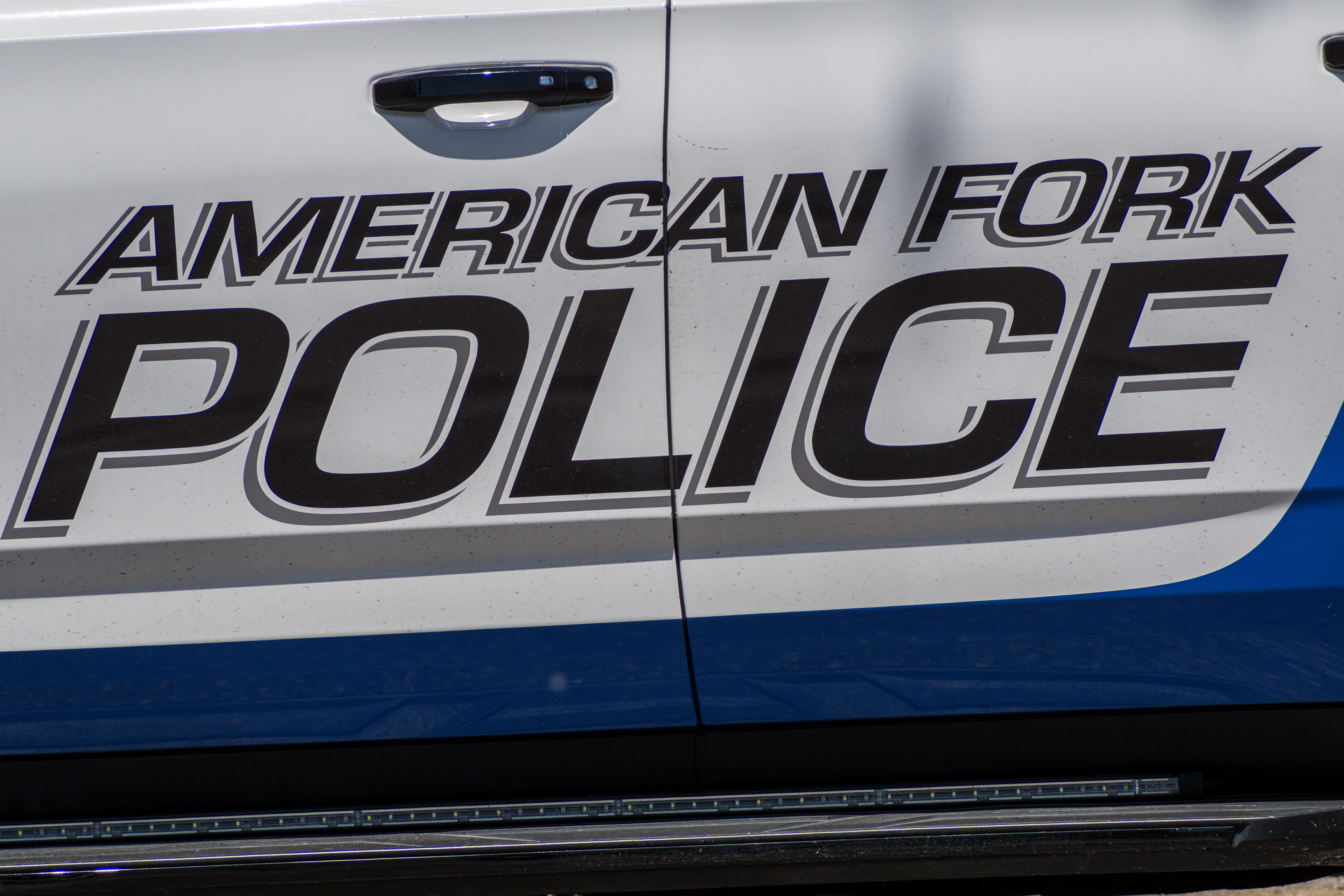 American Fork, Utah – June 2, 2025. Police vehicles are parked outside the American Fork Police Department headquarters.