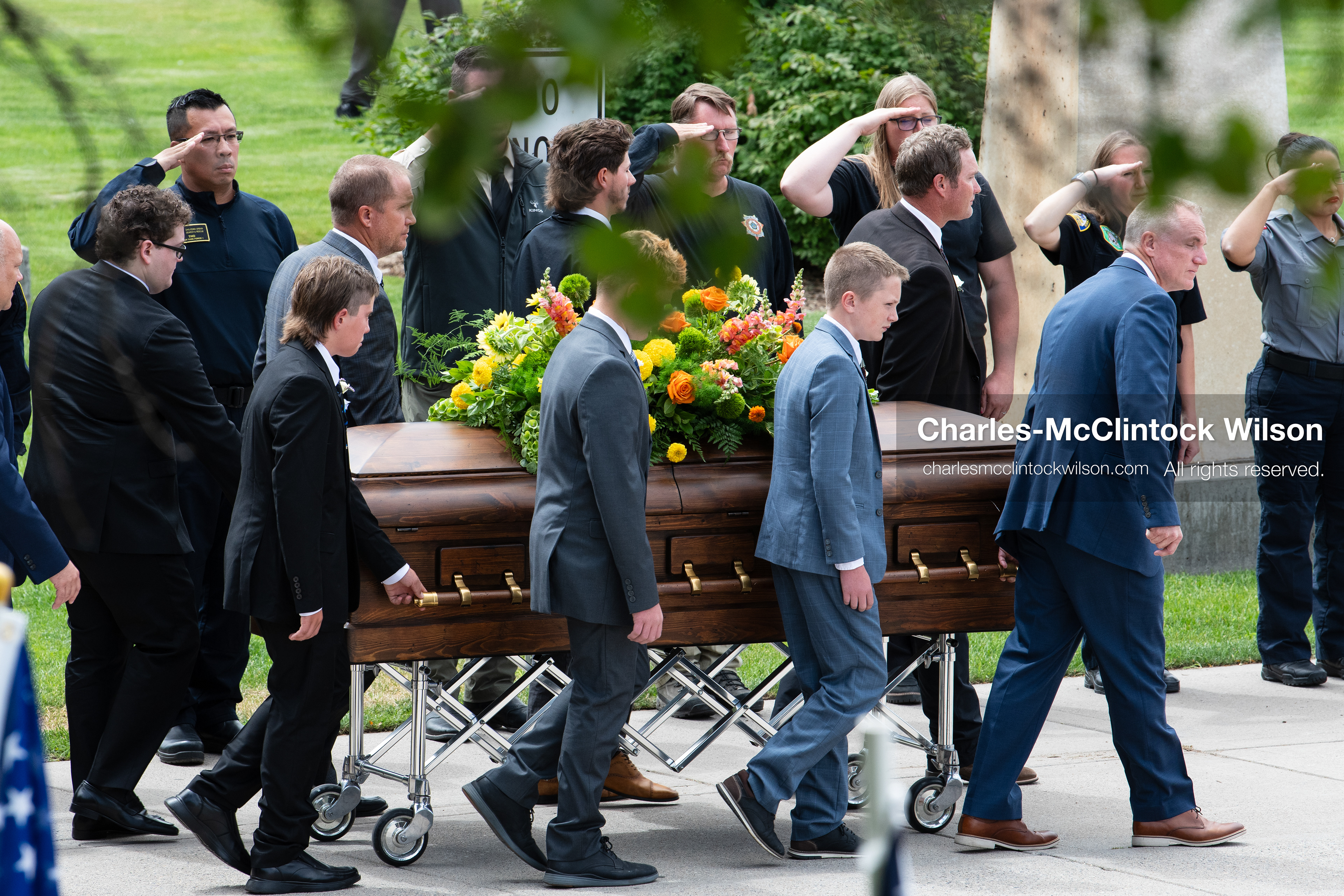 Pallbearers and family members escort the casket of a Long family member outside the UCCU Center at Utah Valley University in Orem, Utah, on Wednesday, July 29, 2026. More than 300 people came to the public memorial ceremony to honor Provo Fire Captain Spencer Long, his wife Katrina, and three of their sons, who died after a flash flood hit their campsite near the Sunglow Campground in Wayne County. (Photo by Charles-McClintock Wilson/Sipa USA)