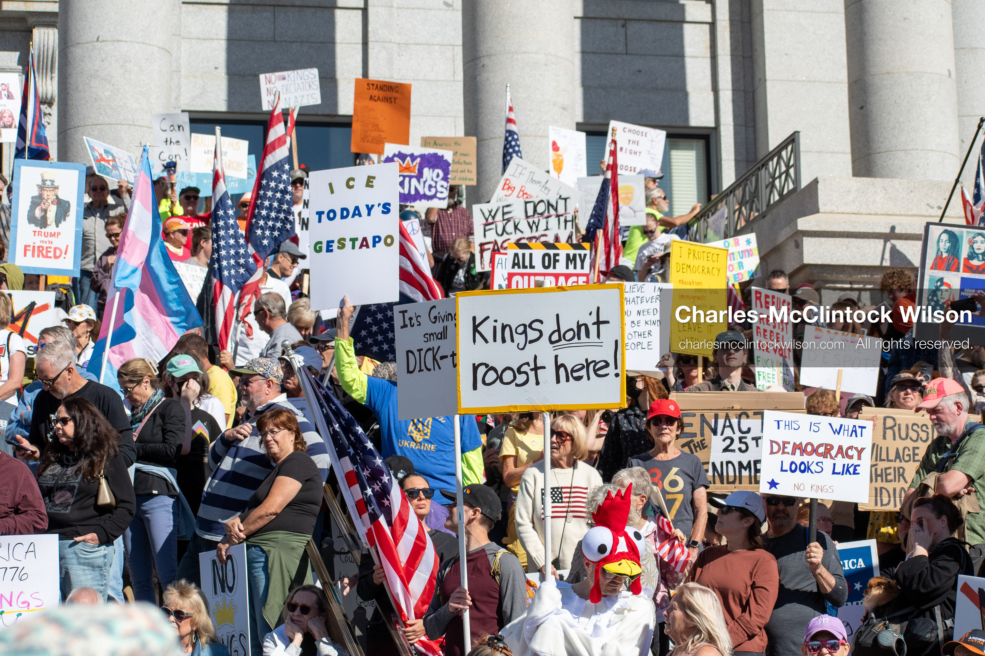 October 18, 2025, Salt Lake City, Utah, USA: Demonstrators participate in a "No Kings" protest held at the Utah State Capitol. Participants hold signs and flags during the public gathering.