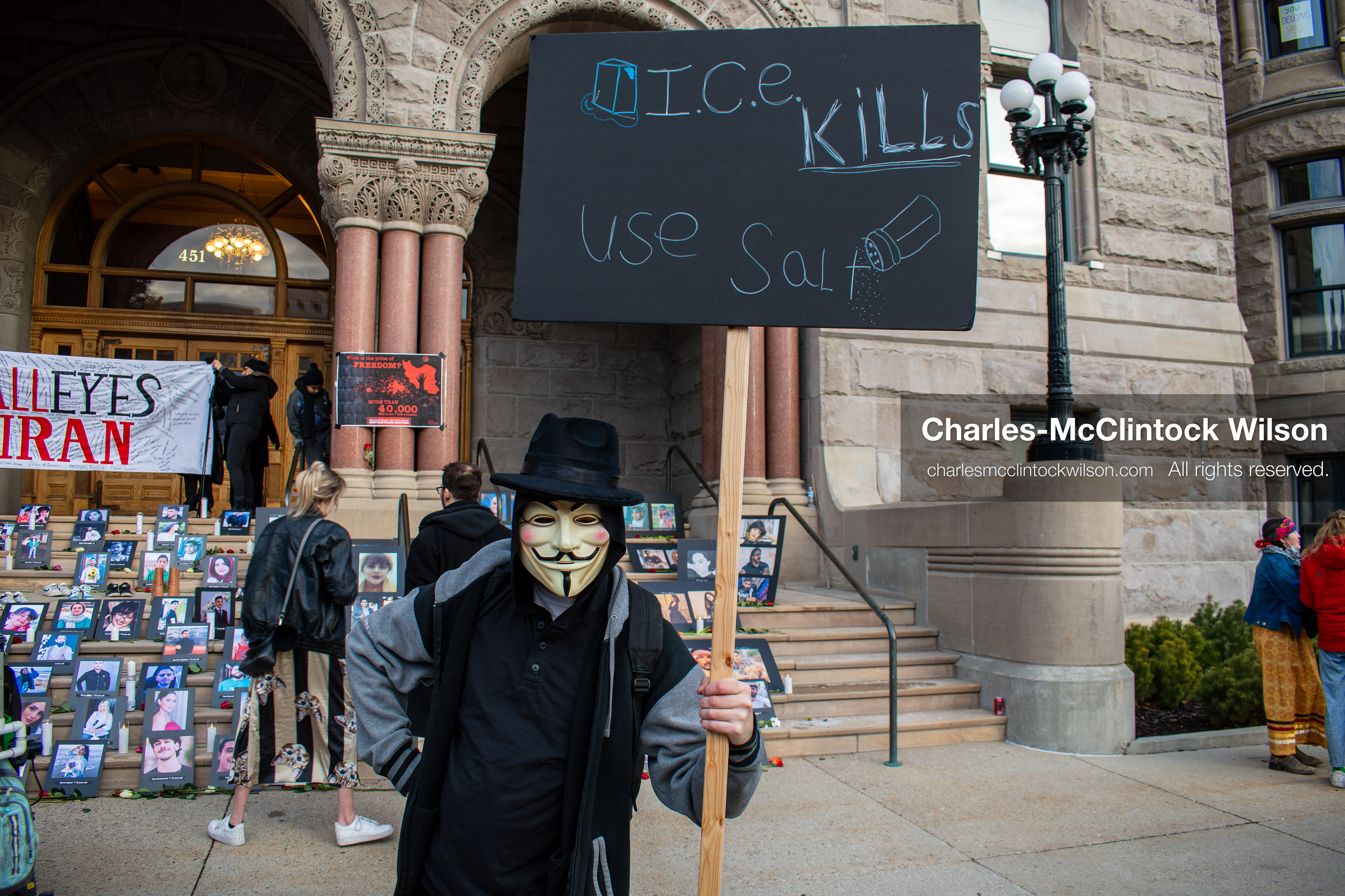 January 30, 2026, Salt Lake City, Utah, USA: A demonstrator stands in front of portraits and a banner during a vigil honoring victims of the Iranian government at the Salt Lake City and County Building. (Credit Image: © Charles McClintock Wilson/ZUMA Press Wire)