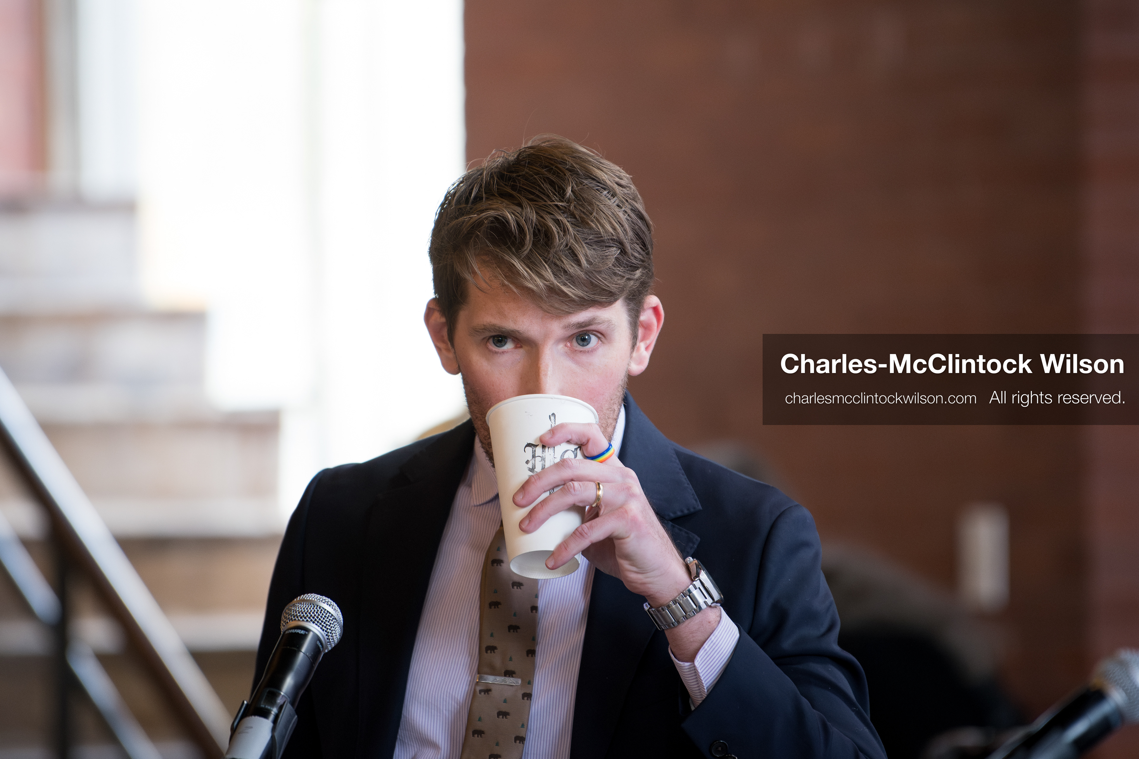 April 22, 2026, Salt Lake City, Utah, USA: Utah state senator NATE BLOUIN, a candidate for the Democratic nomination in the Utah 1st Congressional District, takes a drink while standing at the microphone during the Earth Day 1st District Candidate Debate at Church and State Marketplace in Salt Lake City. The event, hosted by Stewardship Utah, brought together candidates to discuss environmental and policy issues ahead of the 2026 election. (Credit Image: © Charles-McClintock Wilson/ZUMA Press Wire)