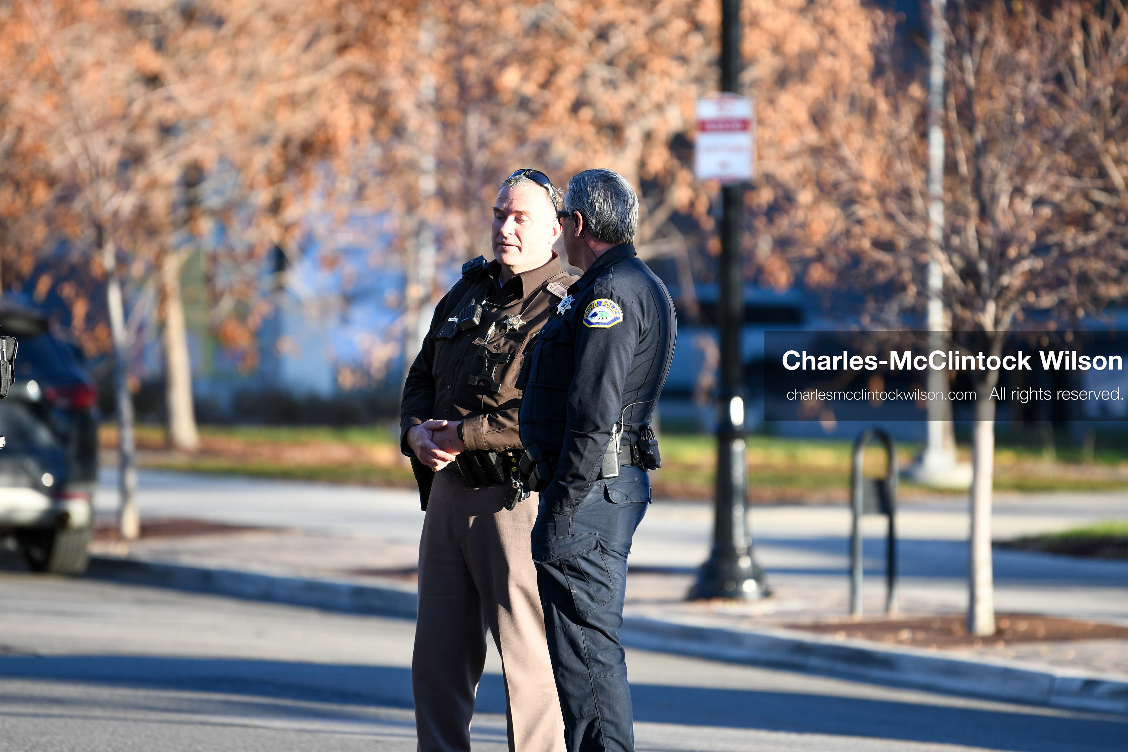 PROVO, UTAH, USA – DECEMBER 11, 2025: A Provo Police officer and a Utah Highway Patrol trooper stand outside the Fourth District Court in Provo during the first in‑person court appearance of Tyler Robinson in the Charlie Kirk murder case. (Credit Image: © Charles‑McClintock Wilson/ZUMA Press Wire)