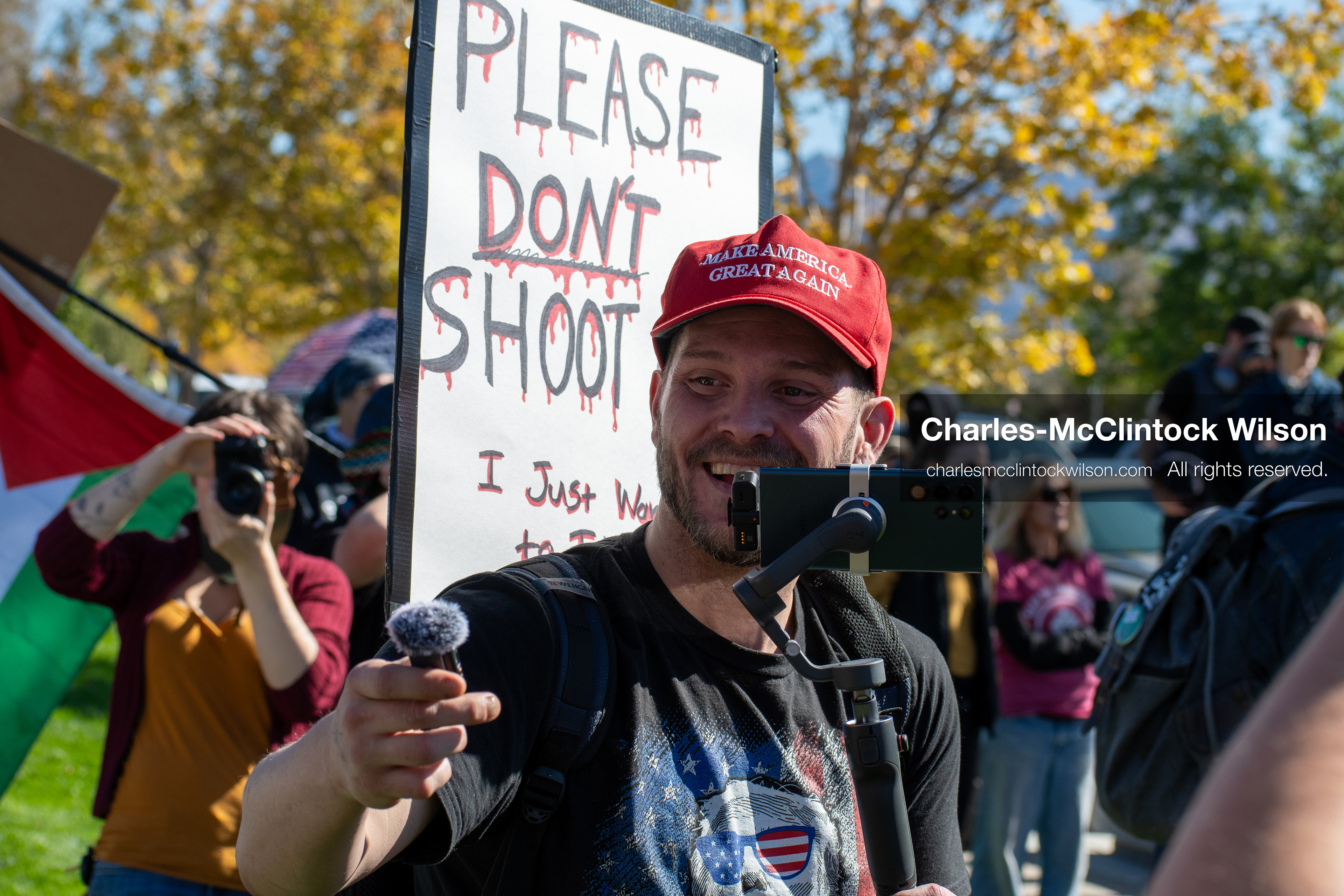 October 18, 2025, Salt Lake City, Utah, USA: A demonstrator records the scene during a "No Kings" protest at the Utah State Capitol. The protest was part of a nationwide mobilization.