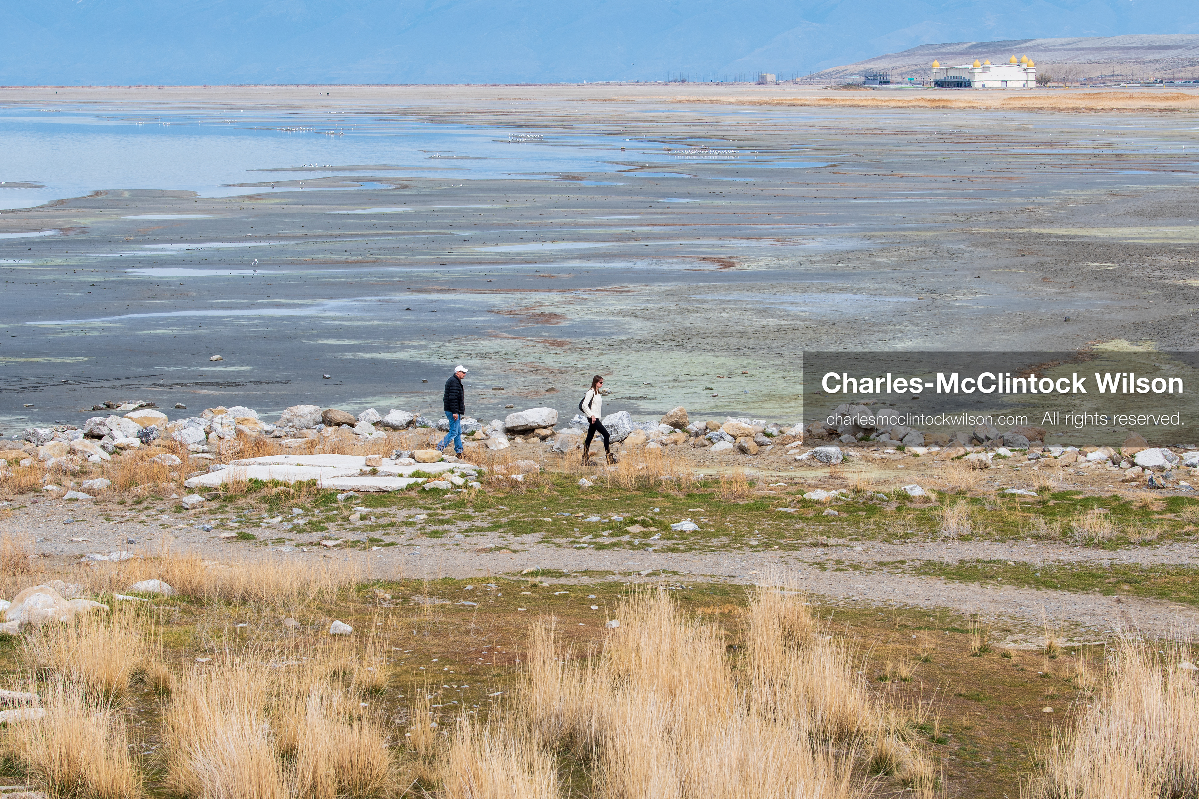 March 1, 2026, Great Salt Lake, Utah, USA: People walk along a path near the shoreline of the Great Salt Lake as the region continues to experience historically low water levels. Reports from state officials and the Great Salt Lake Strike Team state that the lake remains in a serious adverse‑effects range, with elevations among the lowest recorded in more than one hundred years. The lake has drawn increased public attention as lawmakers consider large‑scale water projects and long‑term plans to address declining conditions. (Credit Image: © Charles‑McClintock Wilson/ZUMA Press Wire)