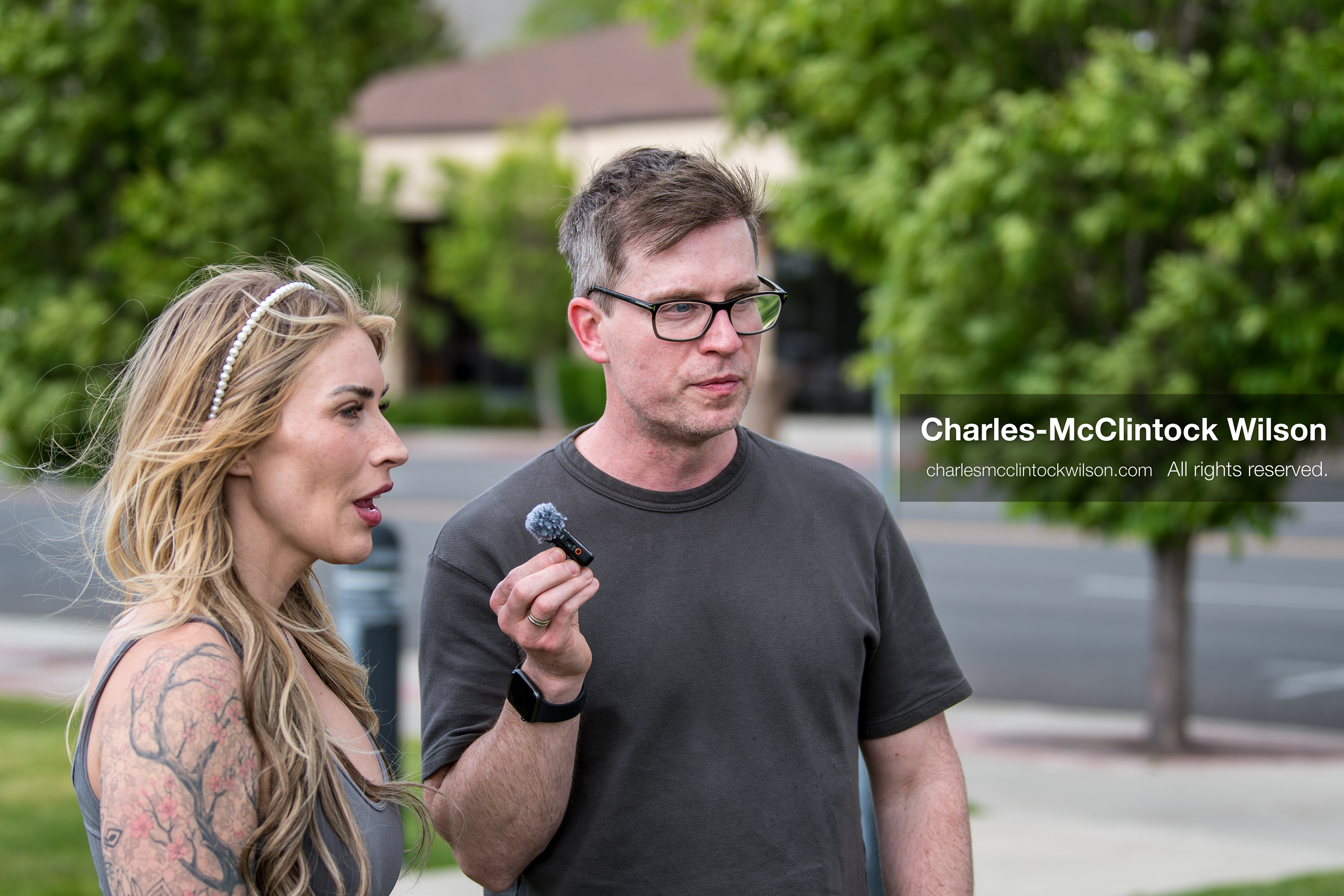 May 13, 2026, Brigham City, Utah, USA: US political satirist and digital creator WALTER MASTERSON interviews a woman outside the Box Elder County Justice Courthouse in Brigham City, Utah, during a gathering over the proposed data‑center project backed by businessman Kevin O’Leary, which has drawn public concern over water use, power demand, and transparency. (Credit Image: © Charles‑McClintock Wilson/ZUMA Press Wire)