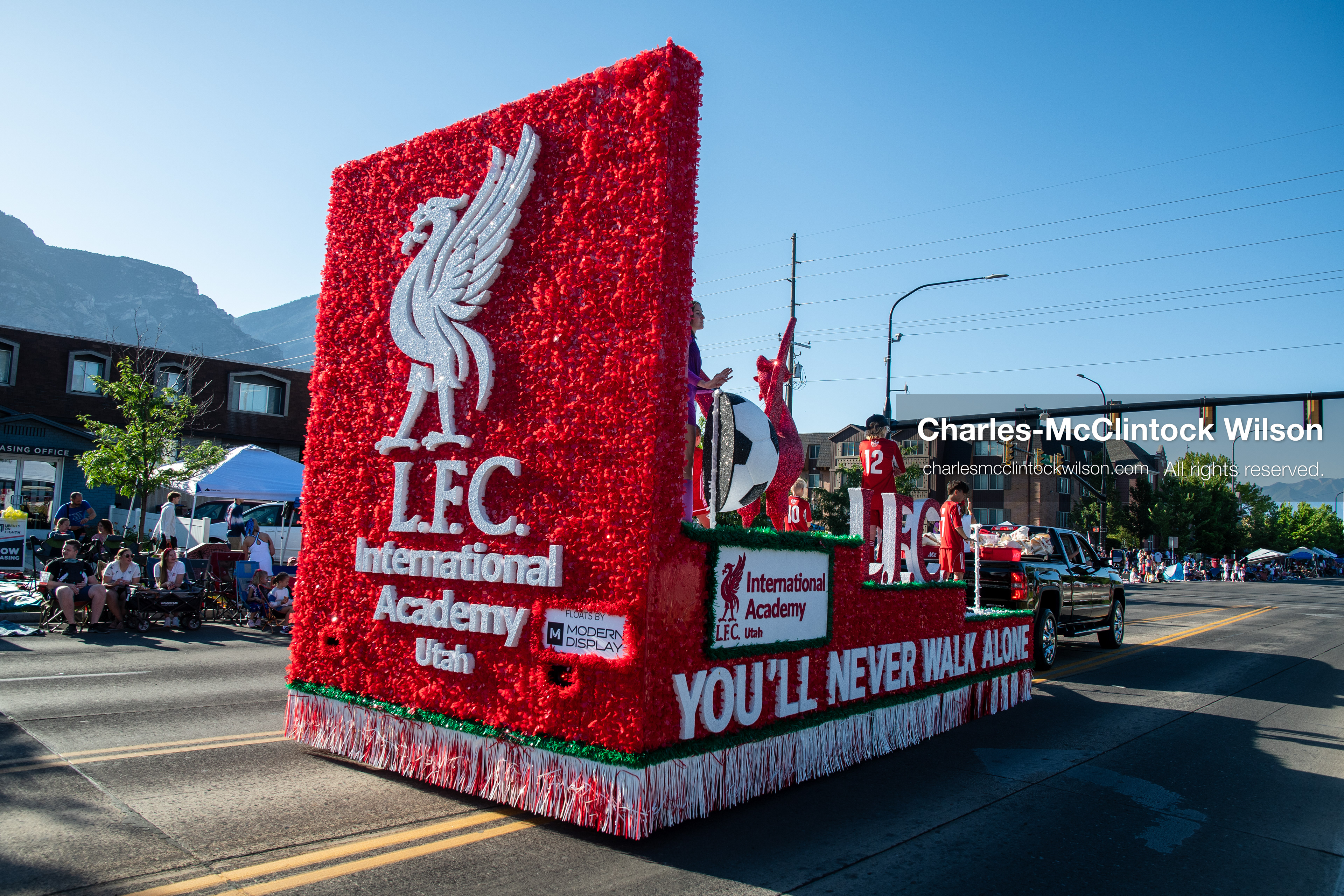 July 4, 2026, Provo, Utah, USA: A pickup truck tows a promotional parade float down the street alongside a person in a unicorn costume during America's Freedom Festival Grand Parade in Provo, Utah, Saturday, July 4, 2026. The annual Independence Day event features expanded programming to honor the 250th anniversary of United States independence. (Credit Image: © Charles-McClintock Wilson/ZUMA Press Wire)