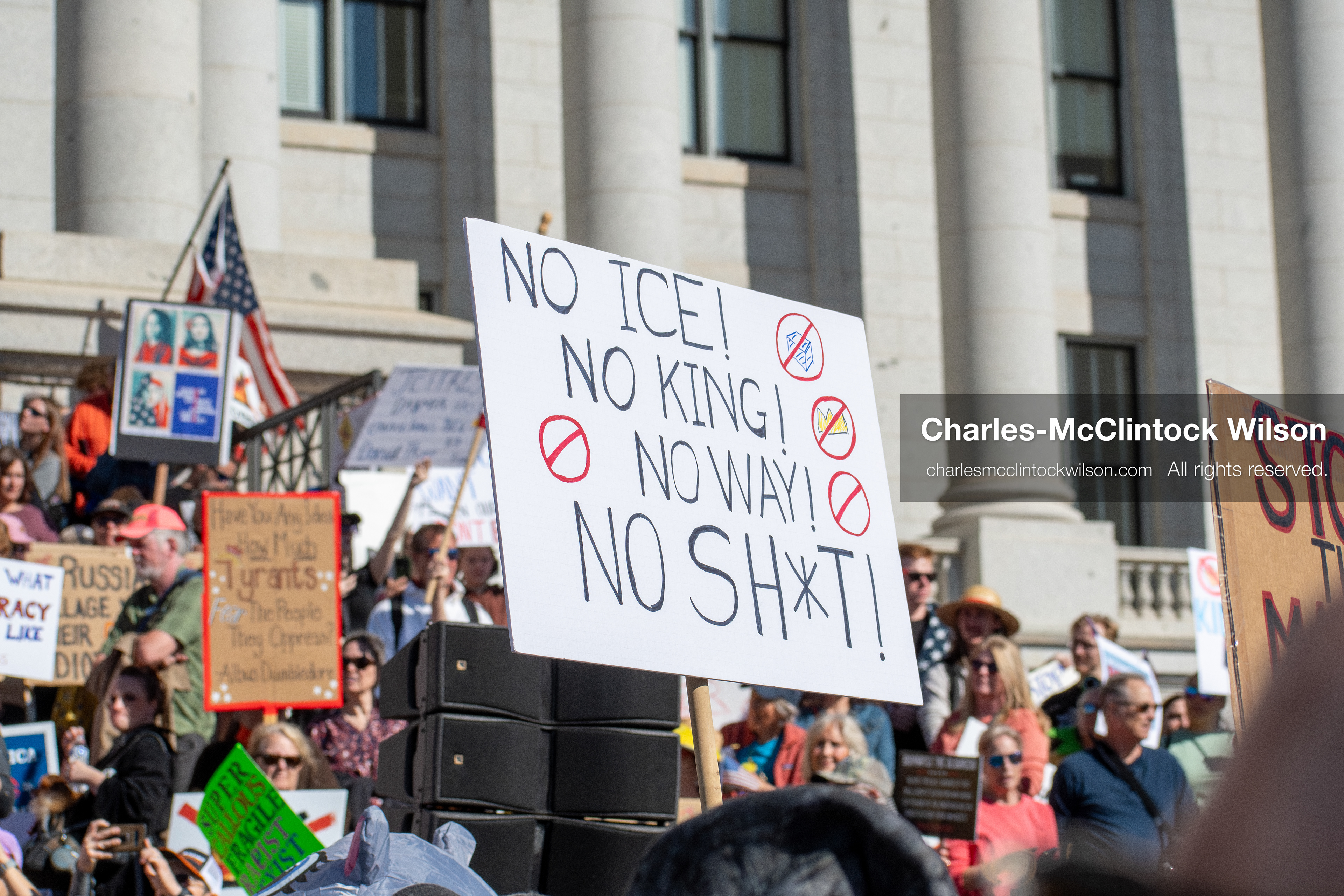 October 18, 2025, Salt Lake City, Utah, USA: Demonstrators participate in a "No Kings" protest held at the Utah State Capitol. Participants hold signs and flags during the public gathering.