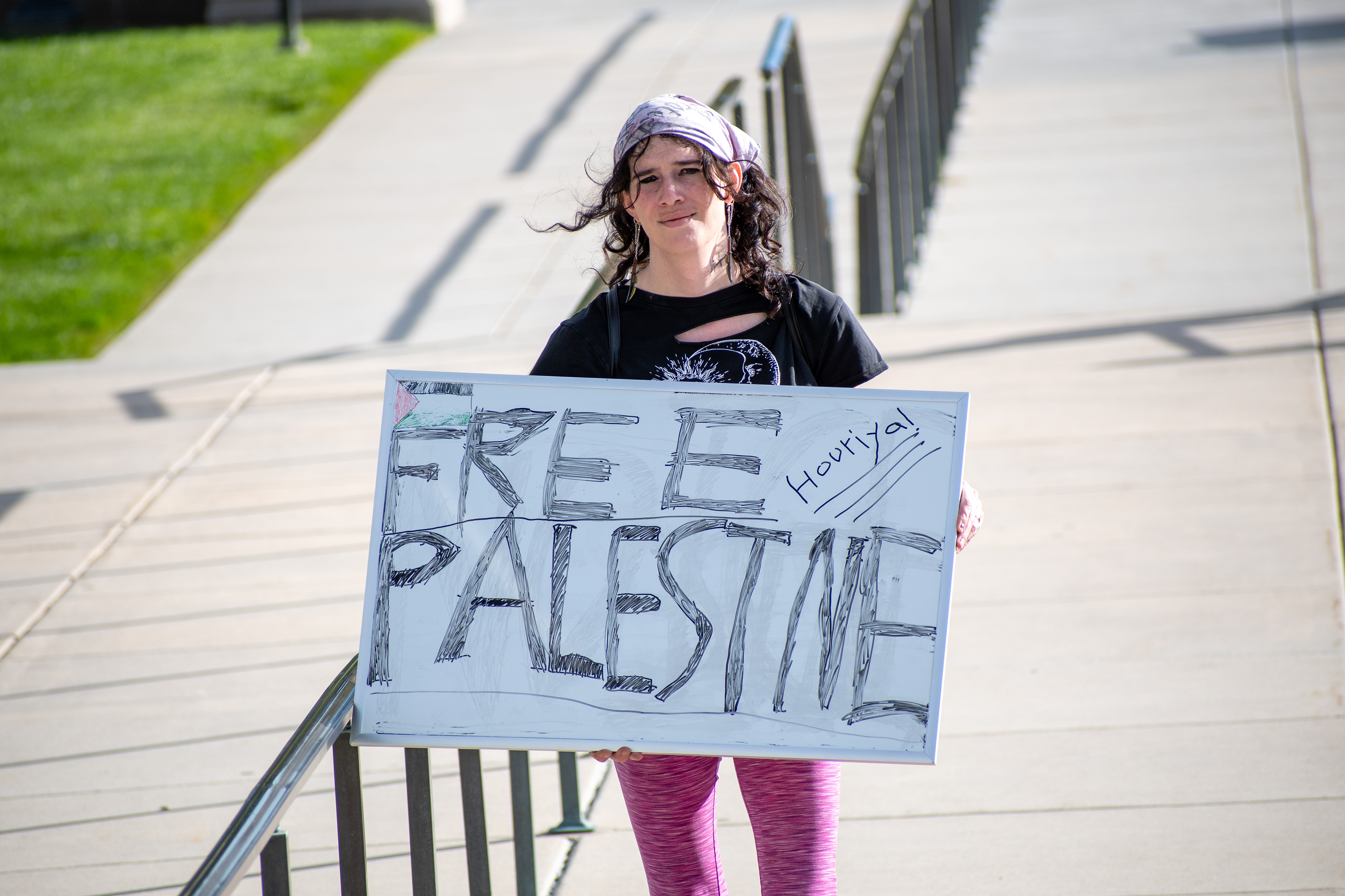 October 10, 2025, Salt Lake City, Utah, USA: A demonstrator walks on a paved walkway during the Free Palestine Rally organized in front of the Utah State Capitol. The participant holds a sign featuring symbolic colors and handwritten messages. (Credit Image: © Charles-McClintock Wilson/ZUMA Press Wire)