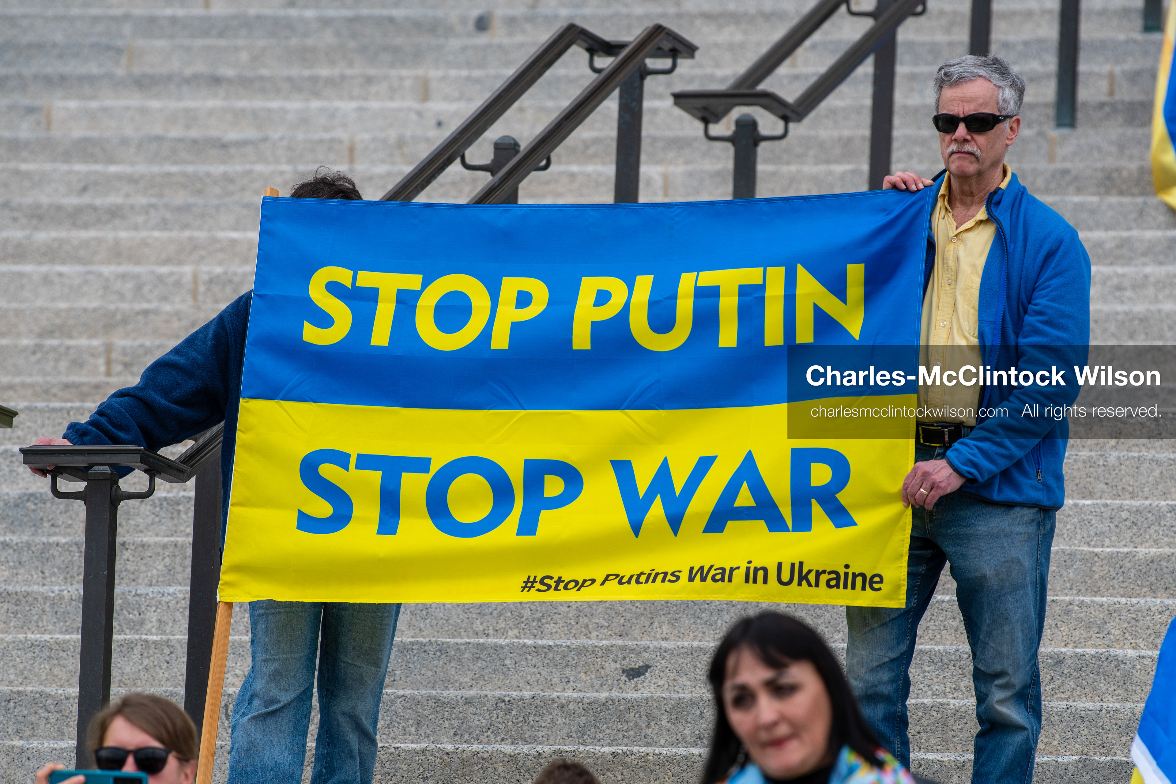  February 28, 2026, Salt Lake City, Utah, USA: Demonstrators hold a large blue and yellow banner resembling the Ukrainian flag with the words Stop Putin Stop War during the Stand With Ukraine rally at the Utah State Capitol. The gathering marked the four year anniversary of the full scale Russian invasion of Ukraine and brought community members together in support of Ukrainians and local humanitarian efforts. (Credit Image: © Charles McClintock Wilson/ZUMA Press Wire)