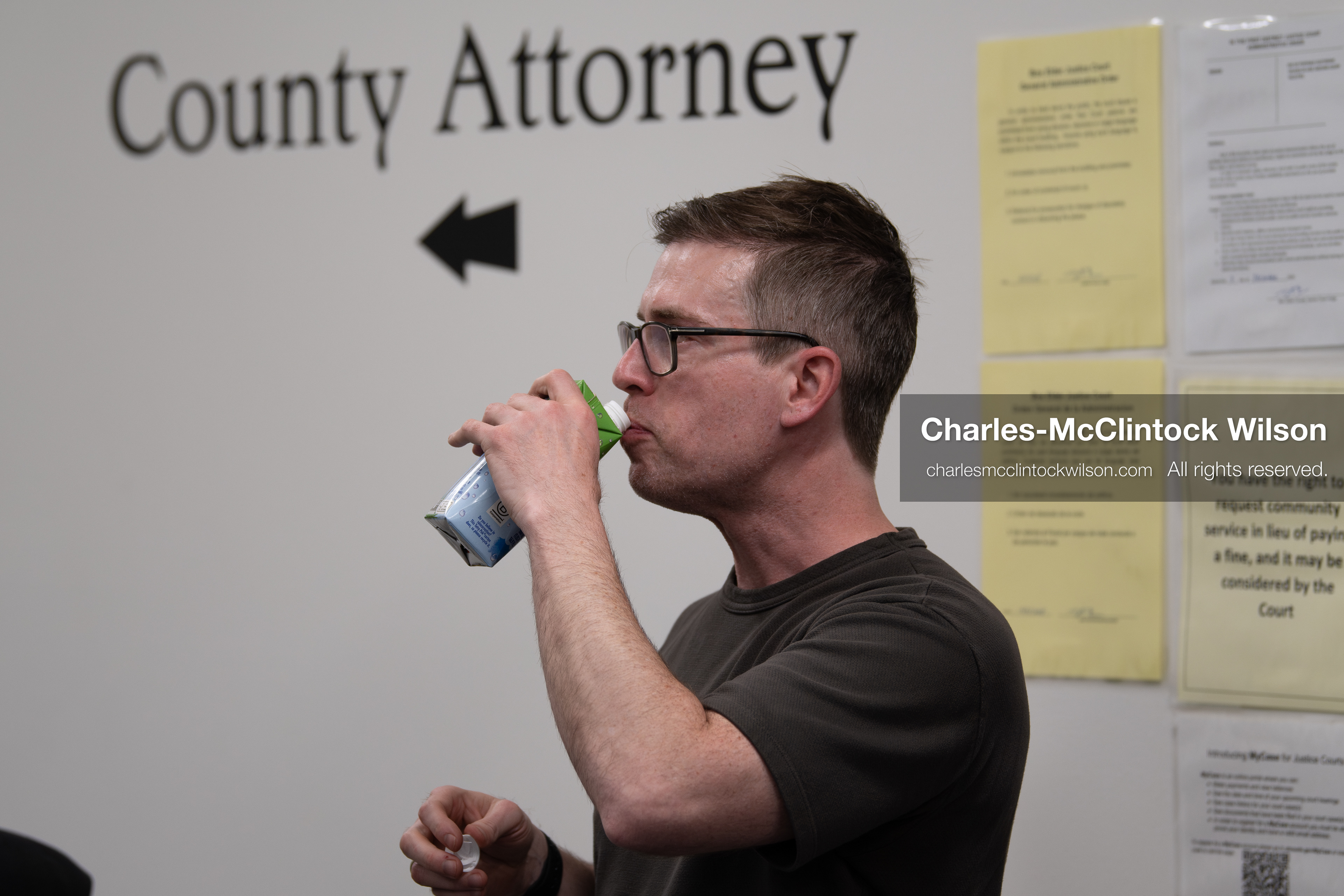 May 13, 2026, Brigham City, Utah, USA: US political satirist and digital creator WALTER MASTERSON drinks from a boxed beverage that appears to be coconut water inside the Box Elder County Justice Courthouse in Brigham City, Utah, on May 13, 2026, during coverage of a gathering over the proposed data center project backed by businessman Kevin O'Leary, which has drawn public concern over water use, power demand, and transparency. (Credit Image: © Charles-McClintock Wilson/ZUMA Press Wire)