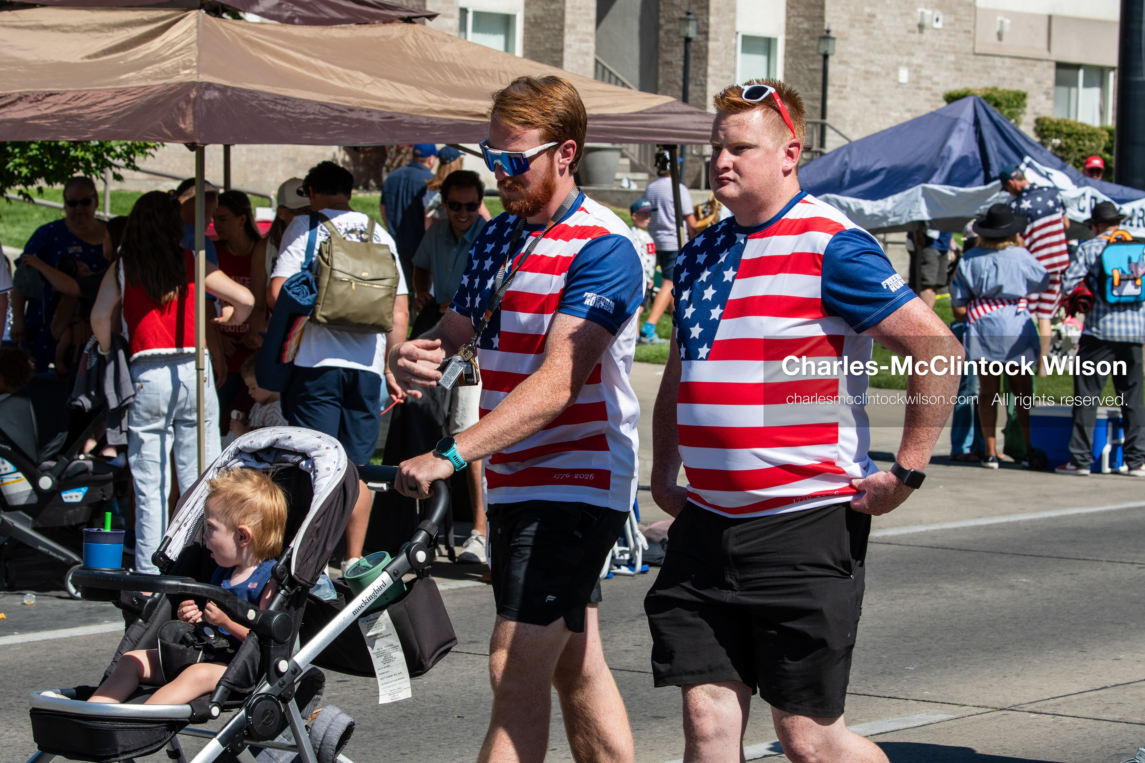 July 4, 2026, Provo, Utah, USA: Participants wearing matching patriotic stars and stripes shirts walk along the street before the start of America's Freedom Festival Grand Parade in Provo, Utah, Saturday, July 4, 2026. The annual Independence Day event features expanded programming to honor the 250th anniversary of United States independence. (Credit Image: © Charles-McClintock Wilson/ZUMA Press Wire)
