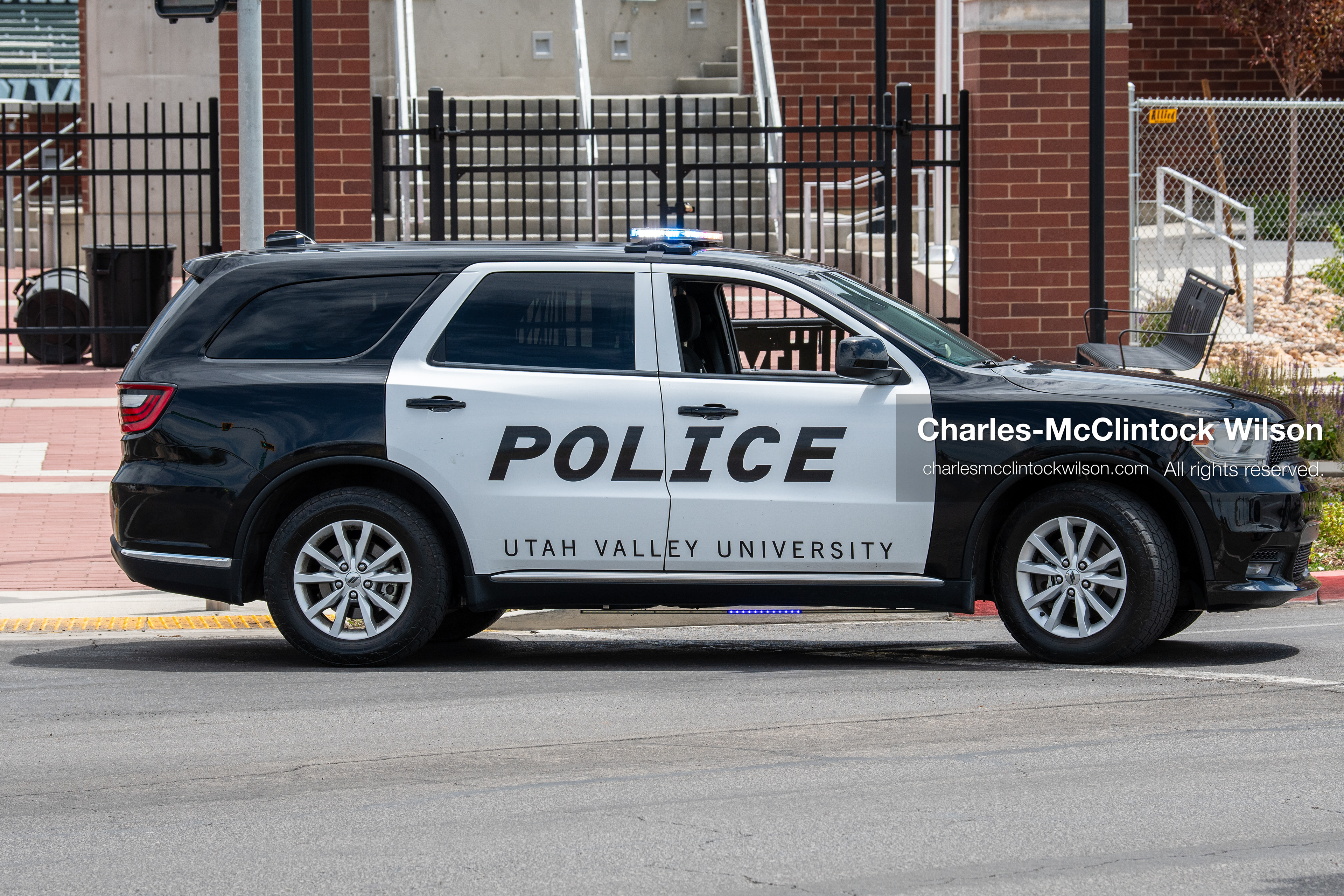 A Utah Valley University Police cruiser sits parked along the roadway perimeter outside the UCCU Center in Orem, Utah, on Wednesday, July 29, 2026. More than 300 people came to the public memorial ceremony to honor Provo Fire Captain Spencer Long, his wife Katrina, and three of their sons, who died after a flash flood hit their campsite near the Sunglow Campground in Wayne County. (Photo by Charles-McClintock Wilson/Sipa USA)