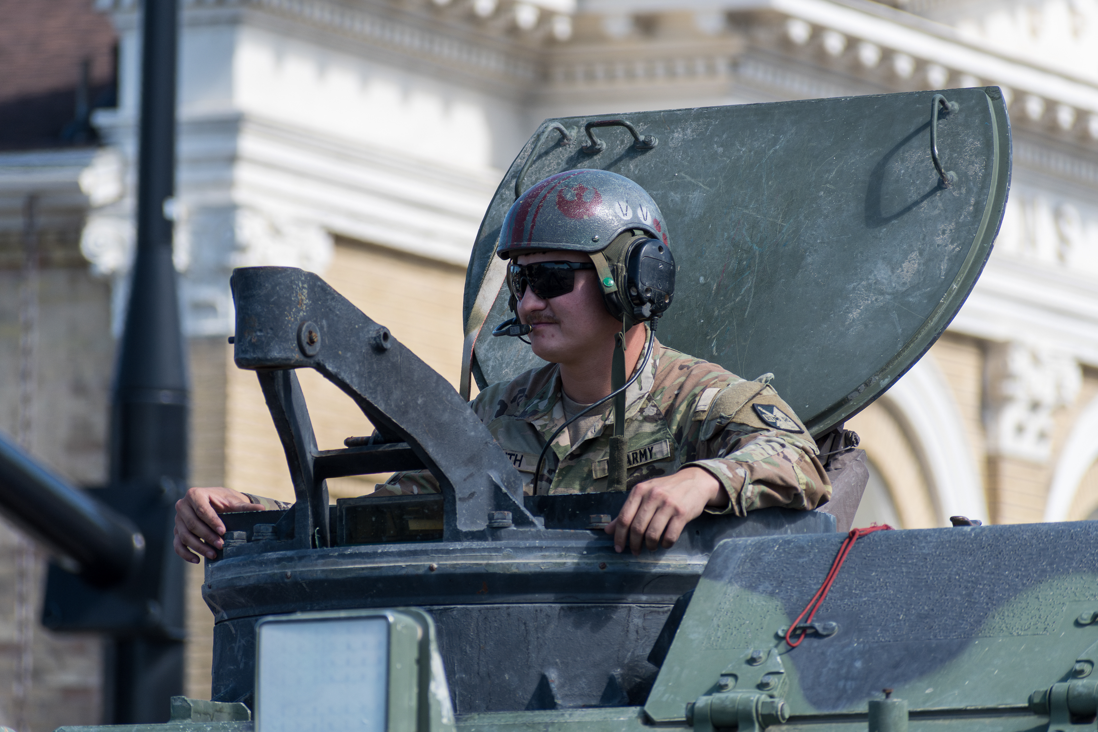 Provo, Utah – July 4, 2025: U.S. Army personnel ride atop a military vehicle during the Freedom Festival Grand Parade, honoring service and adding a patriotic presence to the Independence Day.