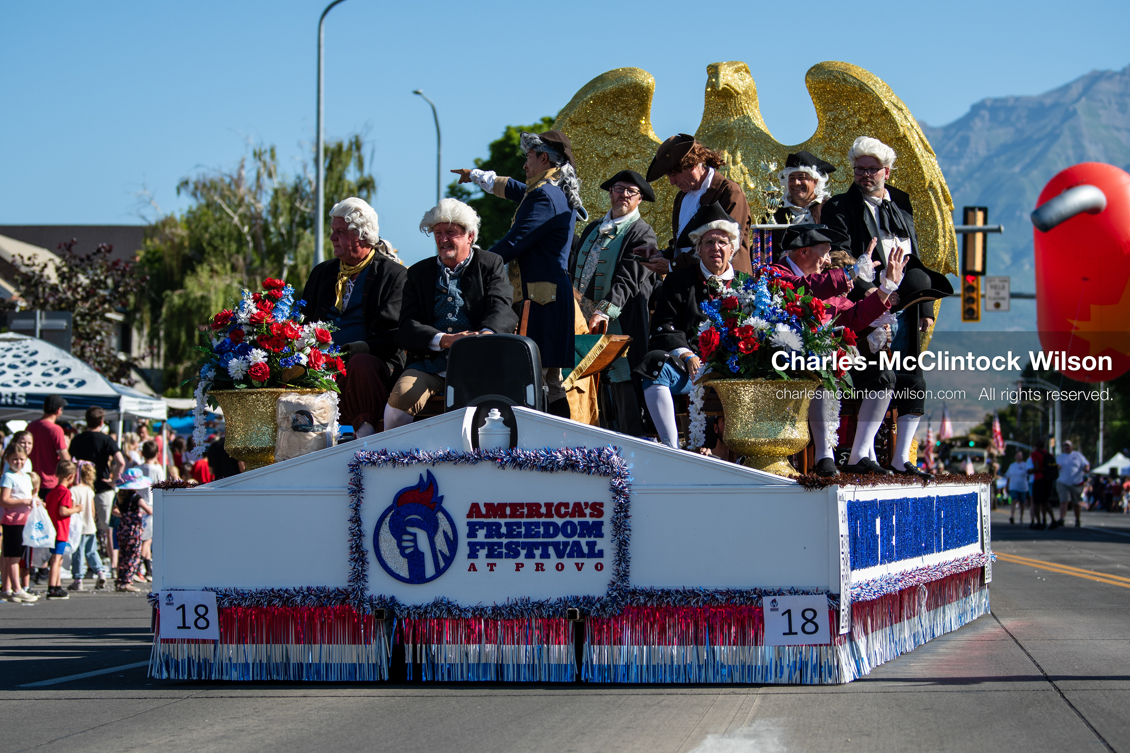 July 4, 2026, Provo, Utah, USA: Participants dressed in historical attire stand aboard a parade float representing the Monument of the Americas during America's Freedom Festival Grand Parade in Provo, Utah, Saturday, July 4, 2026. The annual event drew thousands of spectators to the downtown corridor. (Credit Image: © Charles-McClintock Wilson/ZUMA Press Wire)