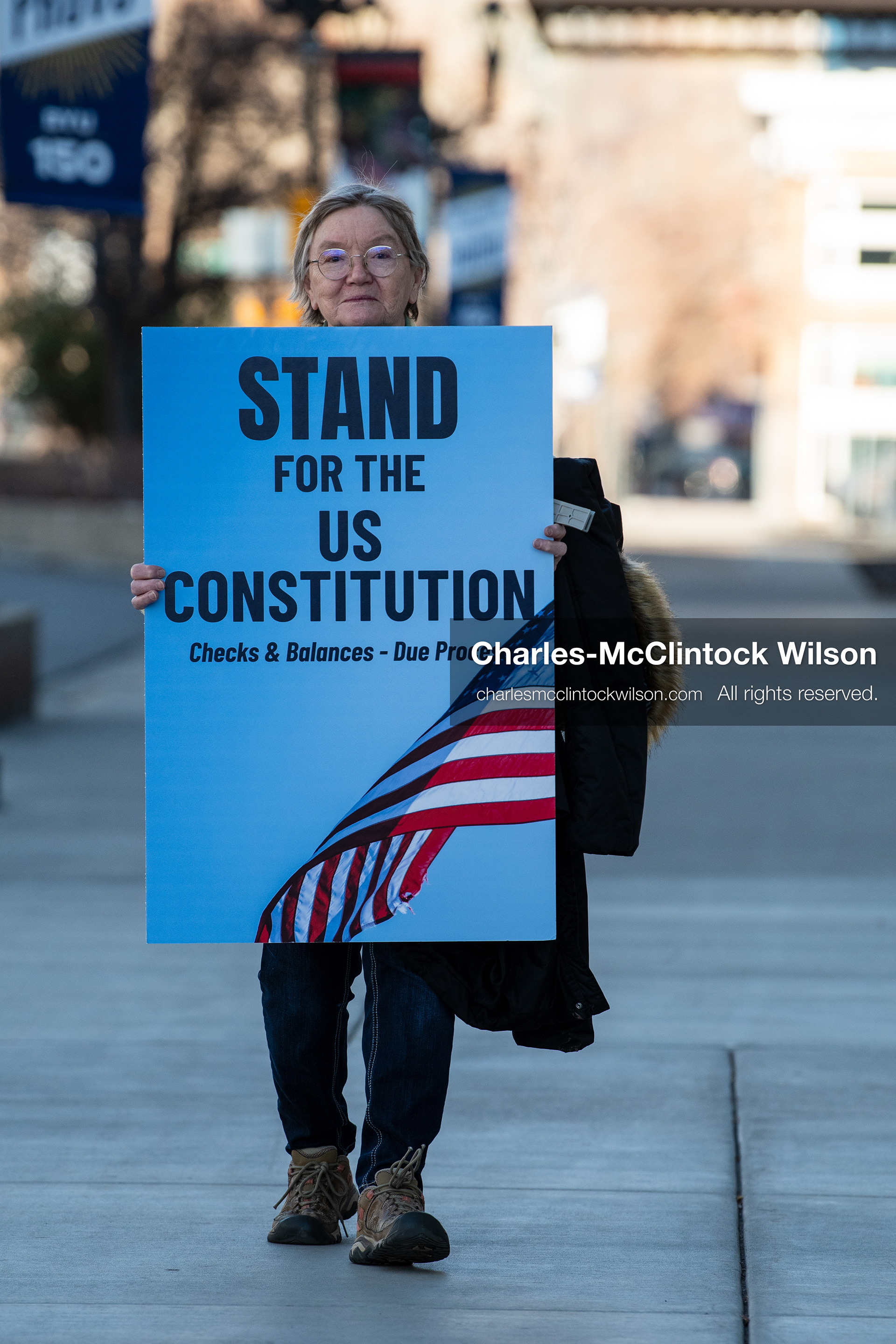 January 20, 2026, Provo, Utah, USA: A demonstrator stands outside Provo City Hall during the Free America Walkout protest in Provo Utah on January 20 2026. The nationwide event called for immigration reform and changes to detention practices. 