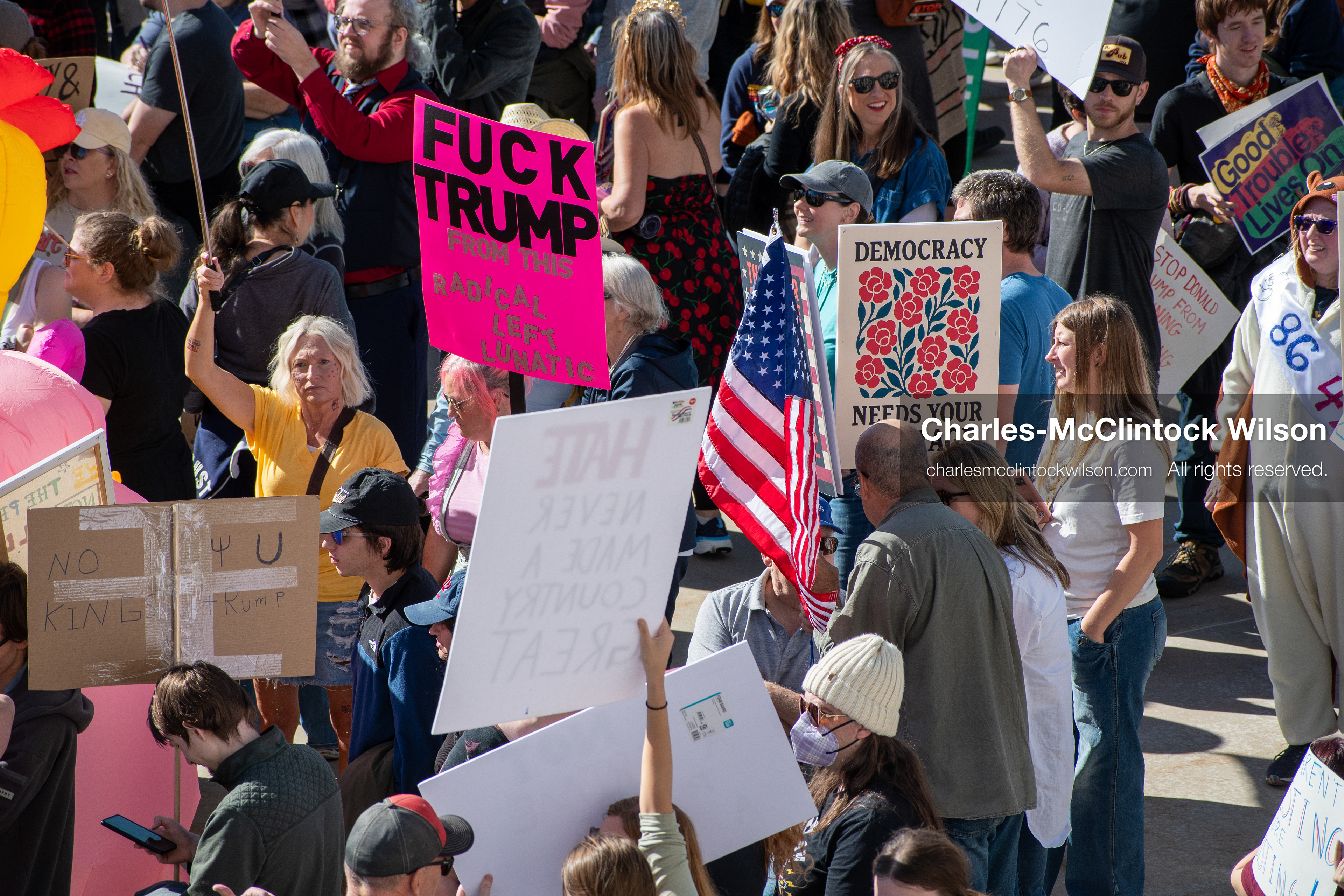 October 18, 2025, Salt Lake City, Utah, USA: Demonstrators participate in a "No Kings" protest held at the Utah State Capitol. Participants hold signs and flags during the public gathering.