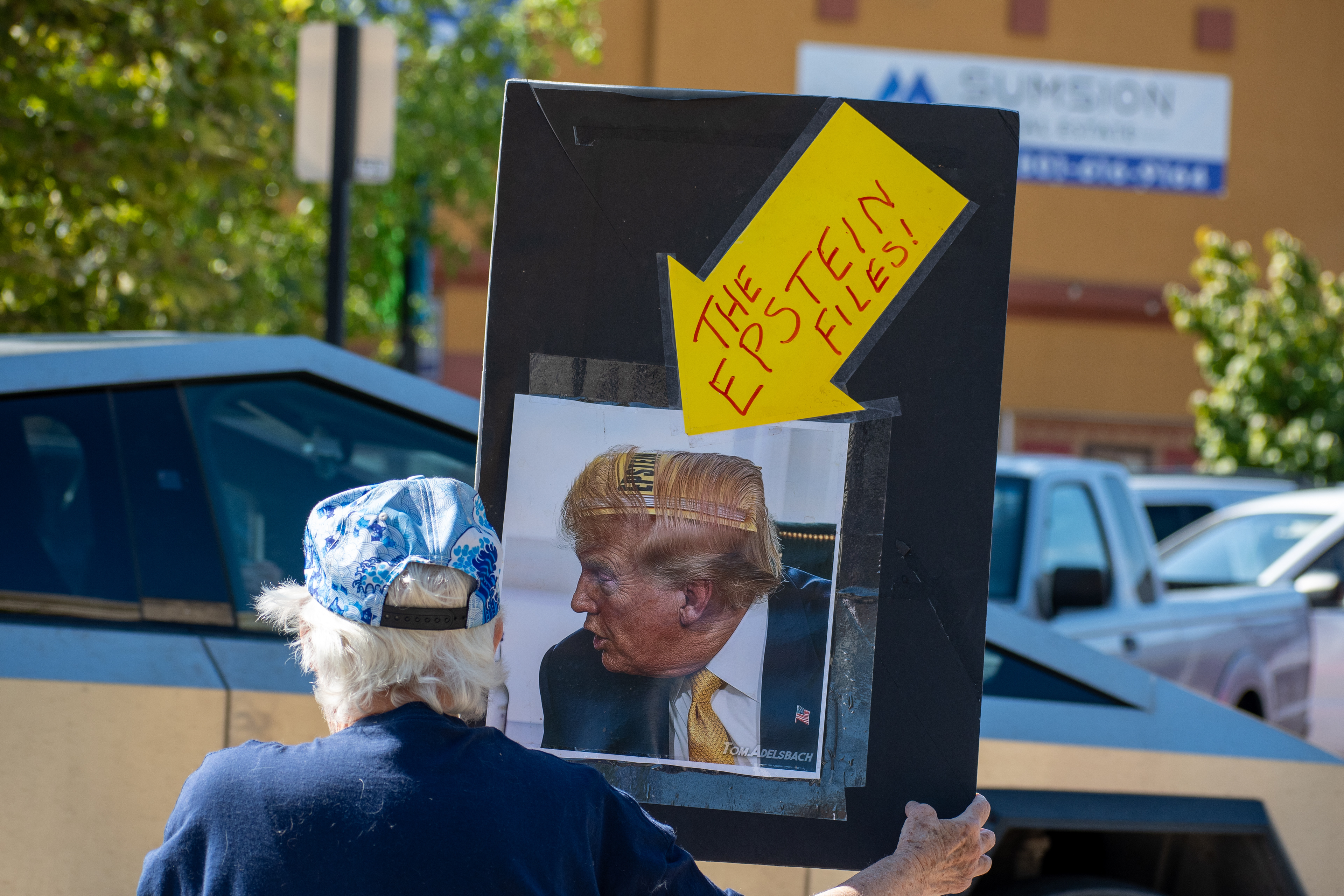 September 15, 2025 – Provo, Utah, United States: An elderly demonstrator holds a sign referencing “THE EPSTEIN FILES!” alongside an image resembling US President Donald Trump, during a protest outside the Utah Valley Convention Center against the Department of Homeland Security career expo. The message invokes political scandal and critiques elite power structures. Photograph by Charles‑McClintock Wilson / ZUMA Press Wire