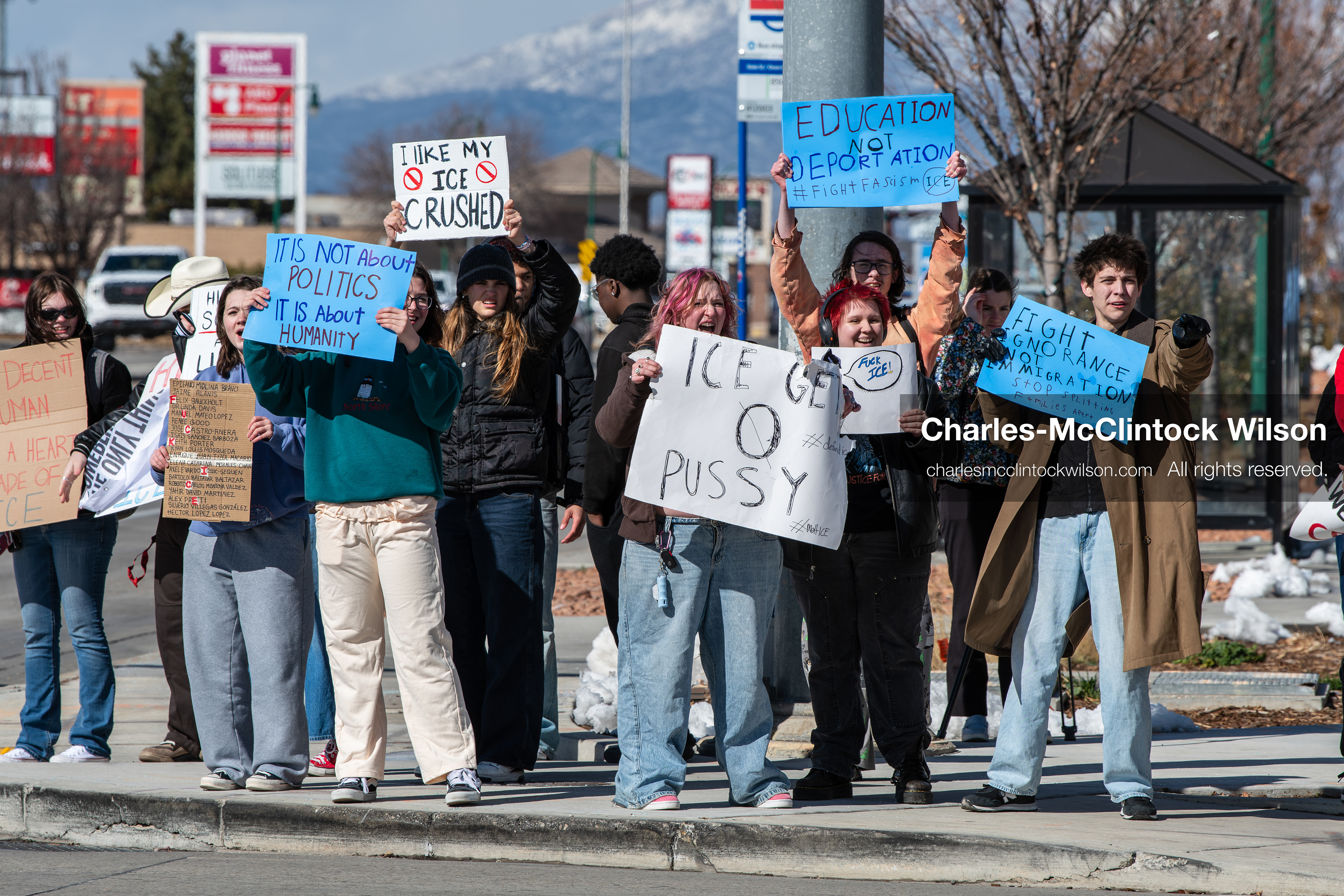 February 20, 2026, Orem, Utah, USA: High school students gather along State Street in front of Orem City Hall during a student led protest against ICE and federal immigration enforcement. Demonstrators hold signs as they stand near the roadway while traffic continues through the area. (Credit Image: © Charles McClintock Wilson/ZUMA Press Wire)