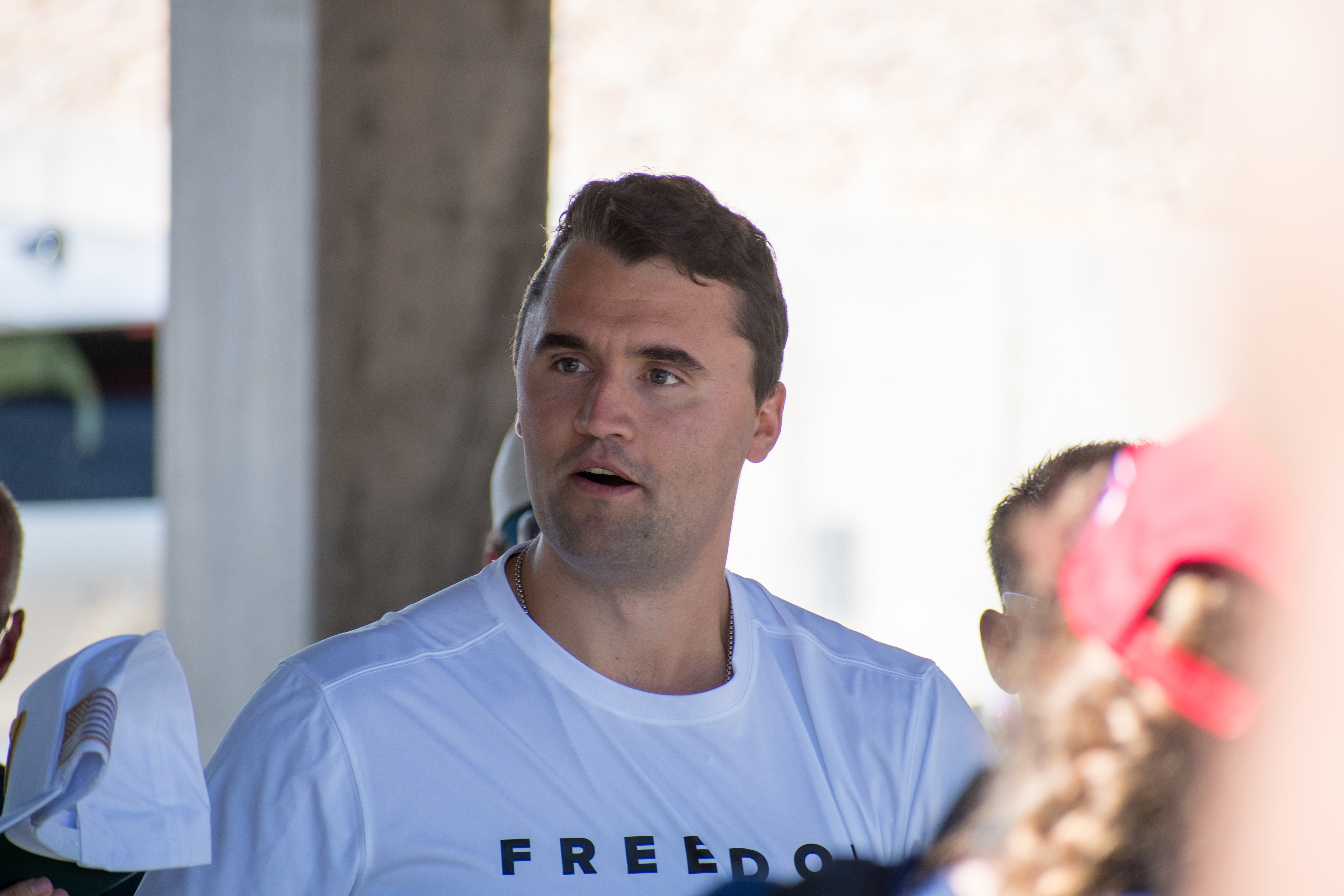 OREM, UTAH – SEPTEMBER 10, 2025: Charlie Kirk arrives at Utah Valley University for a scheduled public event. Wearing a shirt emblazoned with the word “FREEDOM,” Kirk walks among supporters and staff in a moment of visible anticipation. The image marks the beginning of his final public appearance, capturing the atmosphere of civic energy and symbolic presence that defined the day. © Charles-McClintock Wilson / ZUMA Press