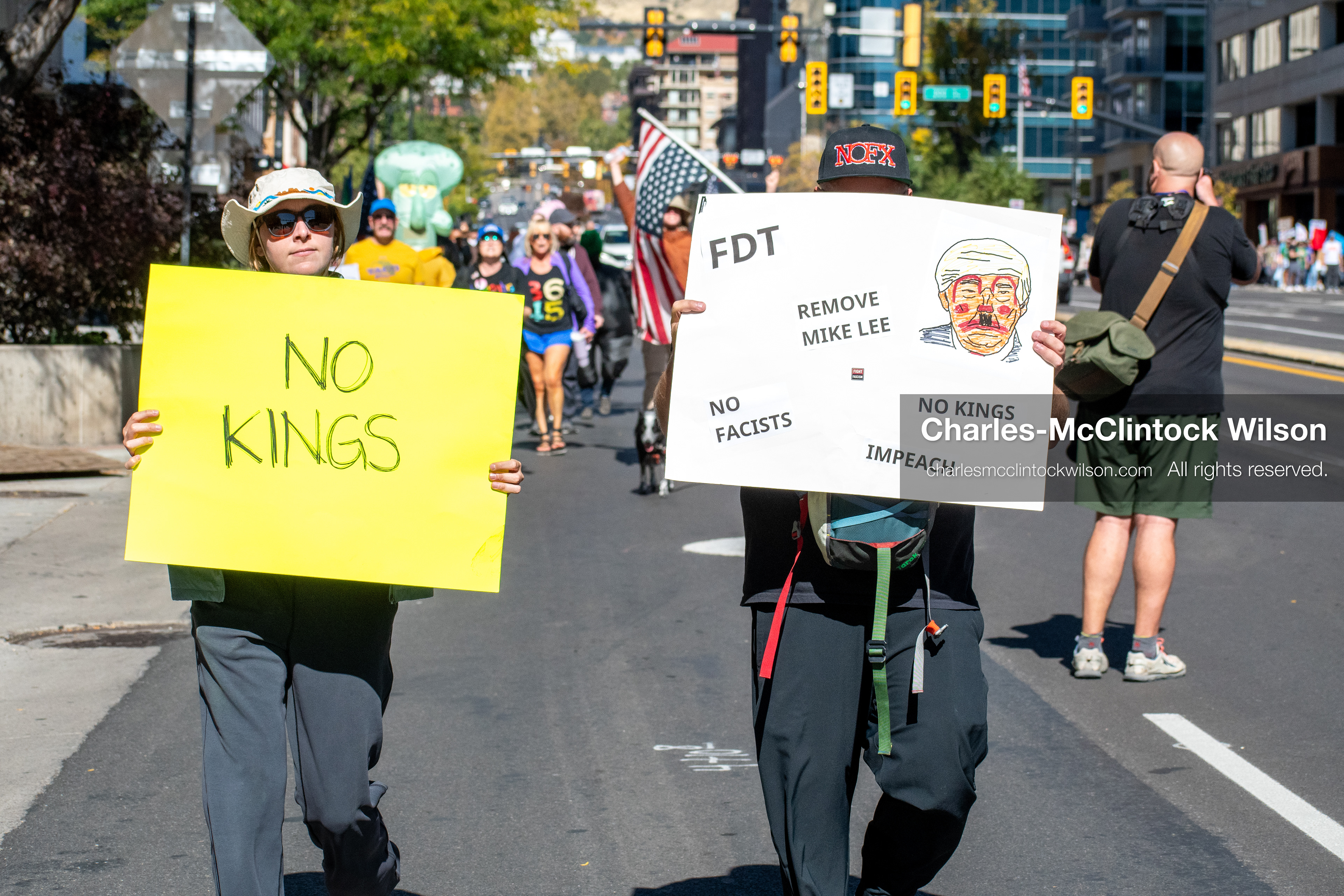 October 18, 2025, Salt Lake City, Utah, USA: Demonstrators march along South State Street during a "No Kings" protest in Salt Lake City, Utah. The protest was part of a nationwide mobilization.