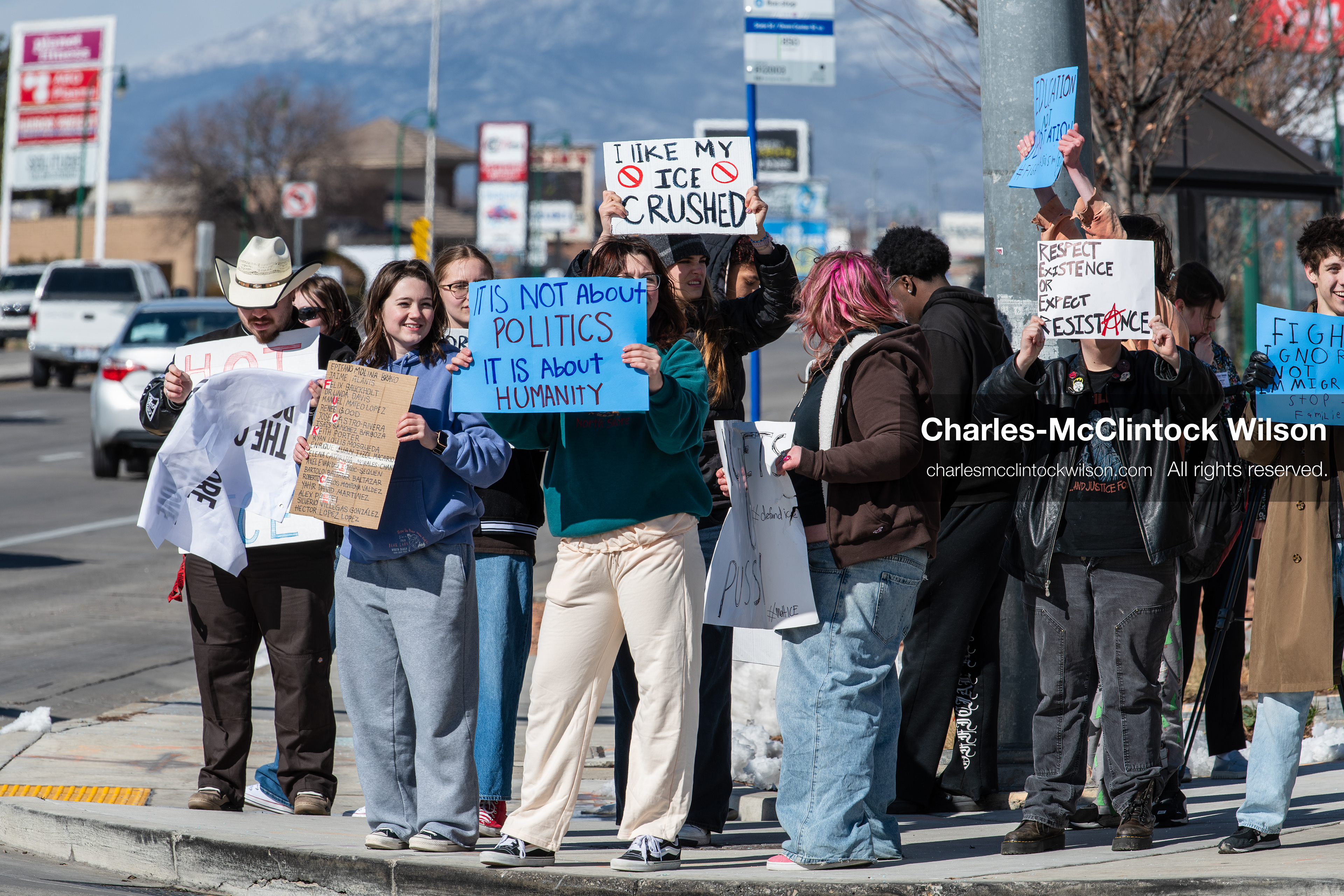 February 20, 2026, Orem, Utah, USA: High school students gather along State Street in front of Orem City Hall during a student led protest against ICE and federal immigration enforcement. Demonstrators hold signs as they stand near the roadway while traffic continues through the area. (Credit Image: © Charles McClintock Wilson/ZUMA Press Wire)