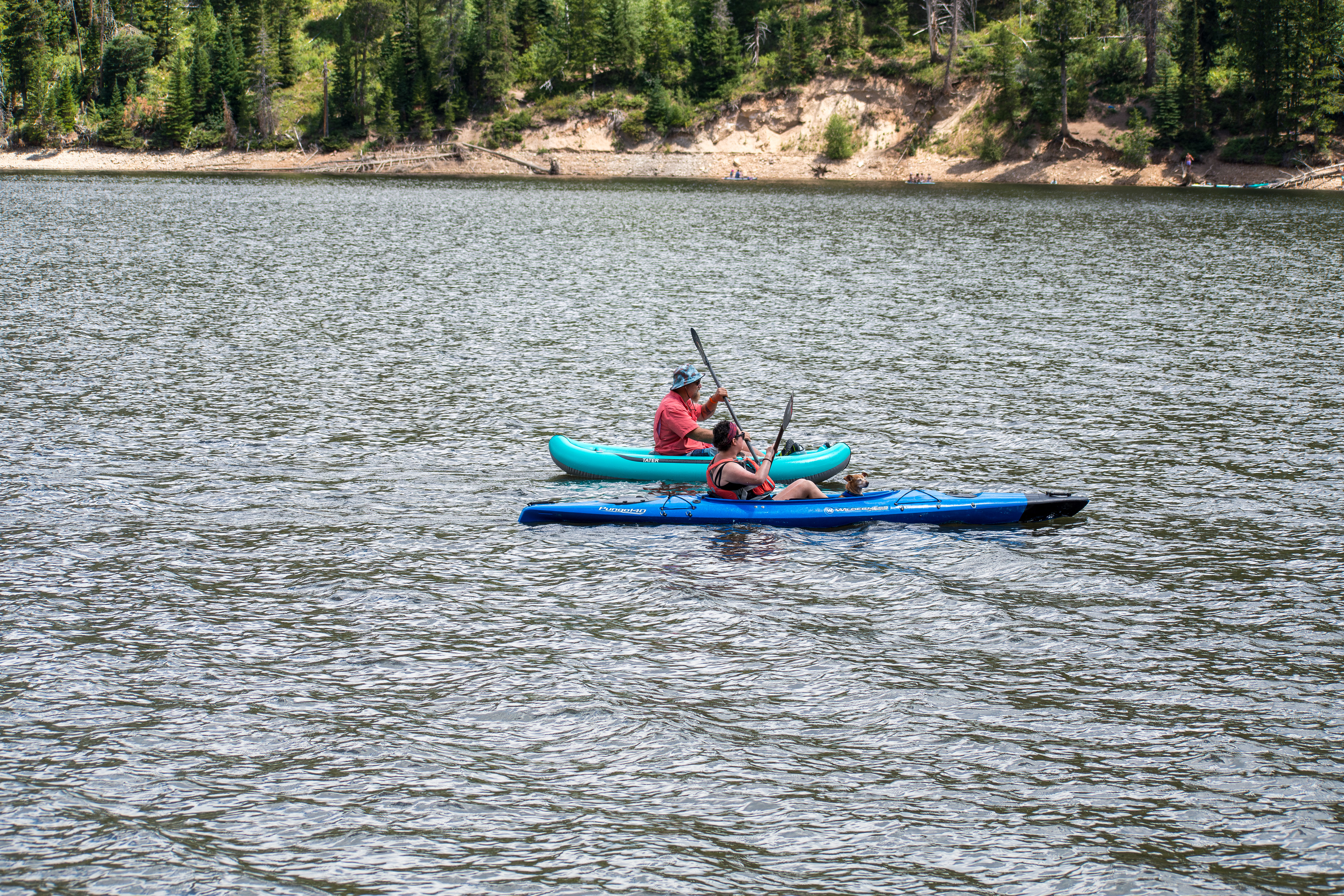 Summit County, Utah – July 20, 2025: People enjoy outdoor recreation on kayaks and paddleboards at Smith and Morehouse Reservoir.