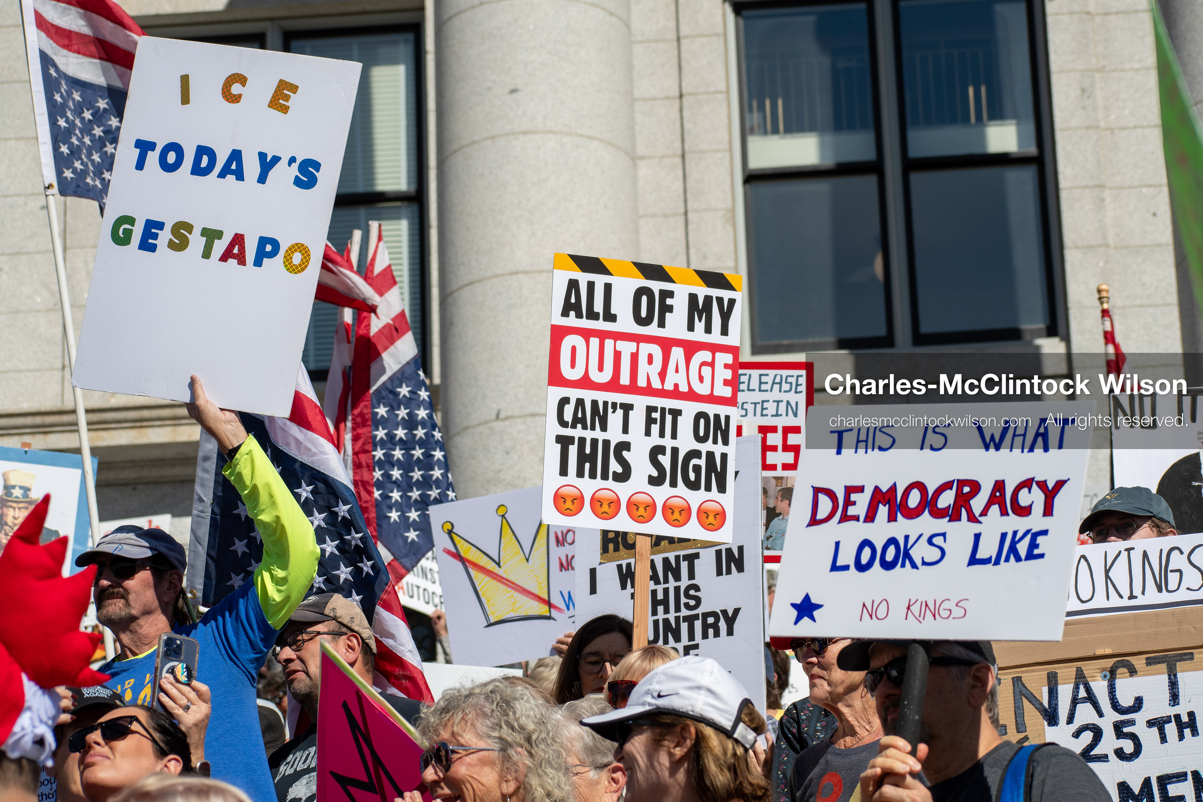 October 18, 2025, Salt Lake City, Utah, USA: Demonstrators participate in a "No Kings" protest held at the Utah State Capitol. Participants hold signs and flags during the public gathering.