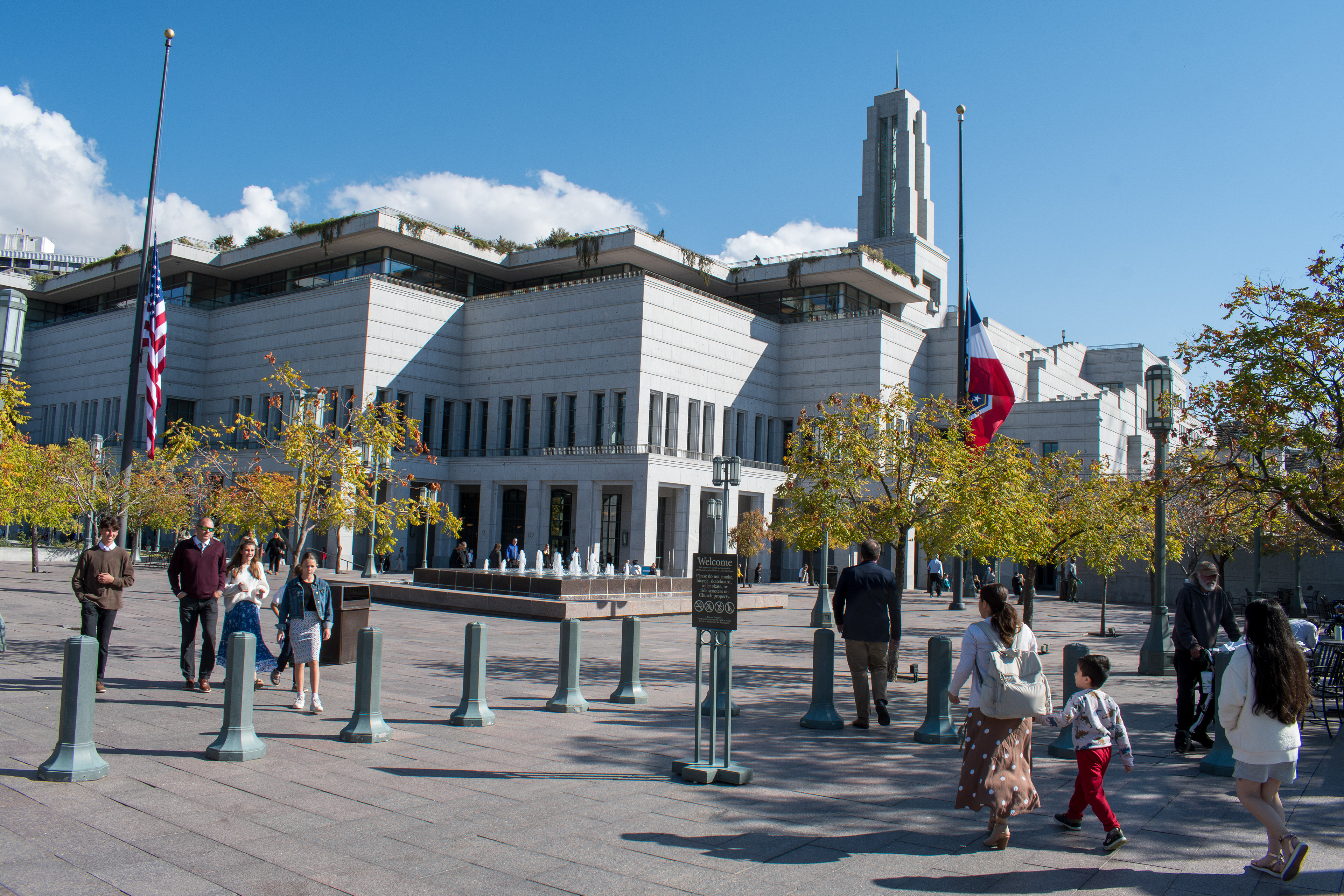 October 6, 2025, Salt Lake City, Utah, USA: People walk through the plaza outside the Conference Center during the public viewing for Russell M. Nelson, the 17th president of the Church of Jesus Christ of Latter-day Saints. Flags fly at half-mast following the death of Nelson at his home in Salt Lake City, Utah, on September 27, 2025, at the age of 101. (Credit Image: © Charles-McClintock Wilson/ZUMA Press Wire)