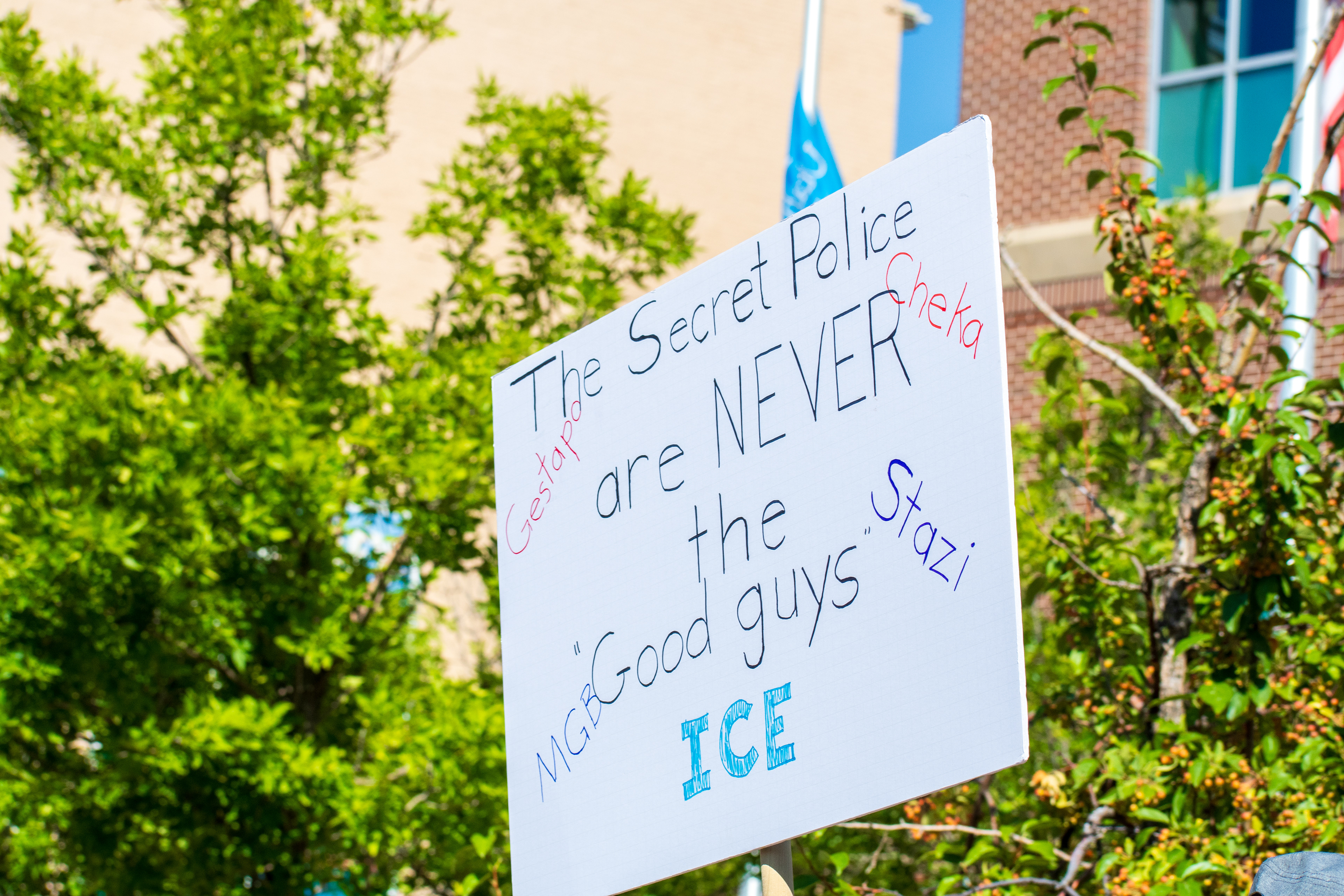 September 15, 2025 – Provo, Utah, United States: A demonstrator holds a sign comparing ICE to historical secret police organizations—including the Gestapo, Cheka, MGB, and Stasi—outside the Utah Valley Convention Center during a protest against the Department of Homeland Security career expo. The message asserts that “The Secret Police are NEVER the Good guys,” invoking historical critique and symbolic resistance. Photograph by Charles‑McClintock Wilson / ZUMA Press Wire