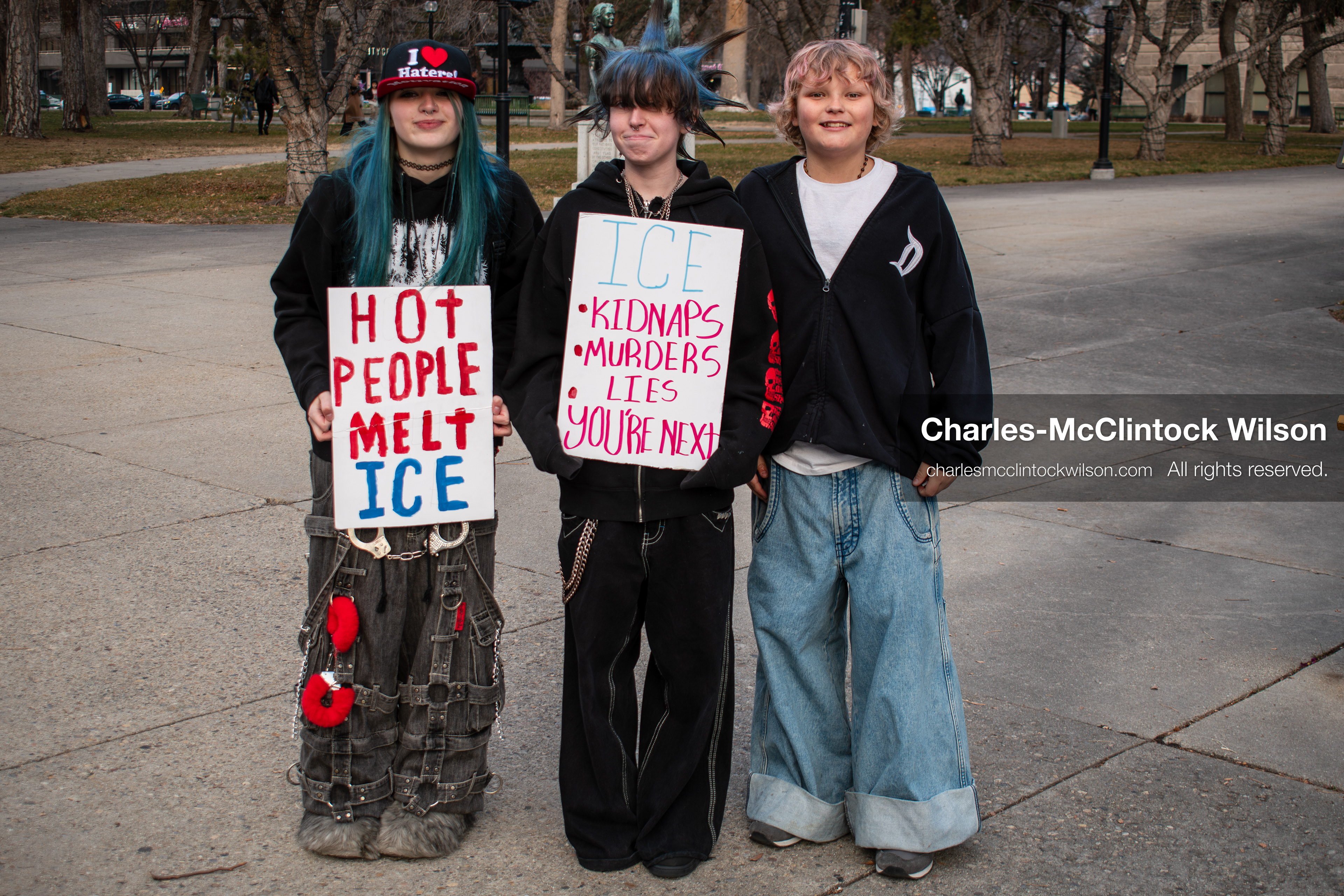 January 30, 2026, Salt Lake City, Utah, USA: Three young demonstrators stand on a paved plaza during an anti‑ICE protest in Salt Lake City, part of a nationwide response to immigration enforcement policies. (Credit Image: © Charles‑McClintock Wilson/ZUMA Press Wire)