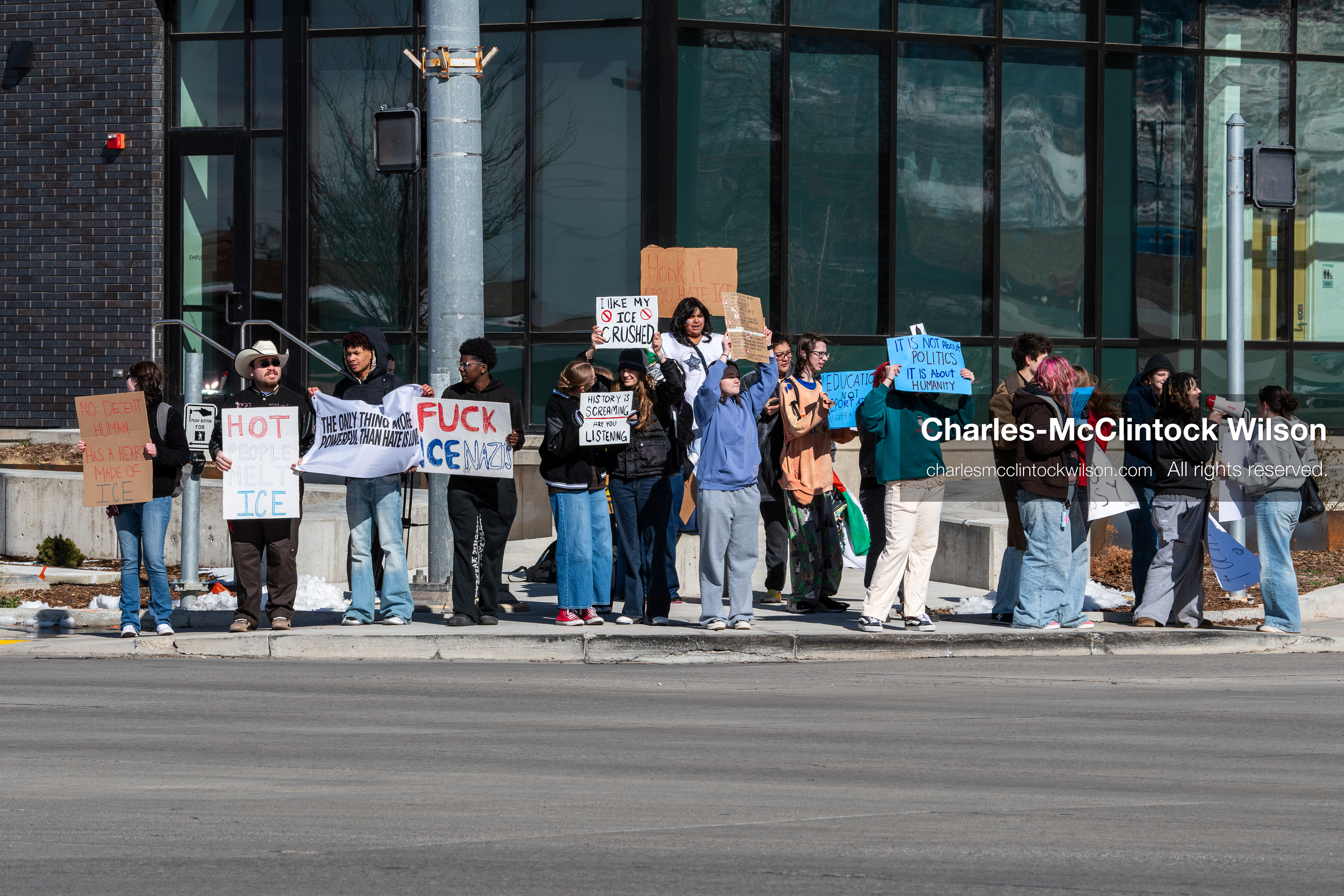 February 20, 2026, Orem, Utah, USA: High school students gather along State Street in front of Orem City Hall during a student led protest against ICE and federal immigration enforcement. Demonstrators hold signs as they stand near the roadway while traffic continues through the area. (Credit Image: © Charles McClintock Wilson/ZUMA Press Wire)
