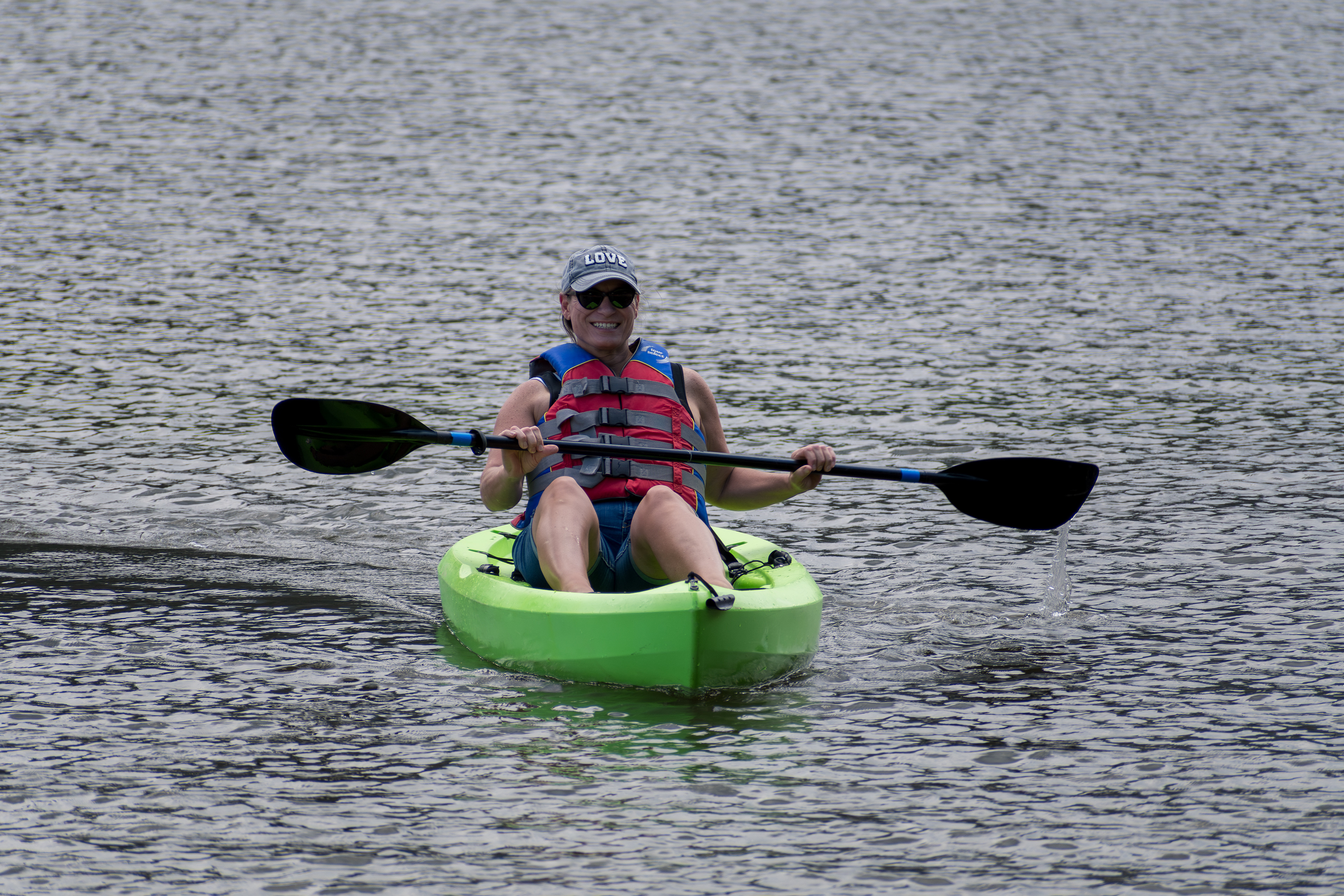 Summit County, Utah – July 20, 2025: A woman paddles a kayak across the calm waters of Smith and Morehouse Reservoir during a peaceful summer outing.