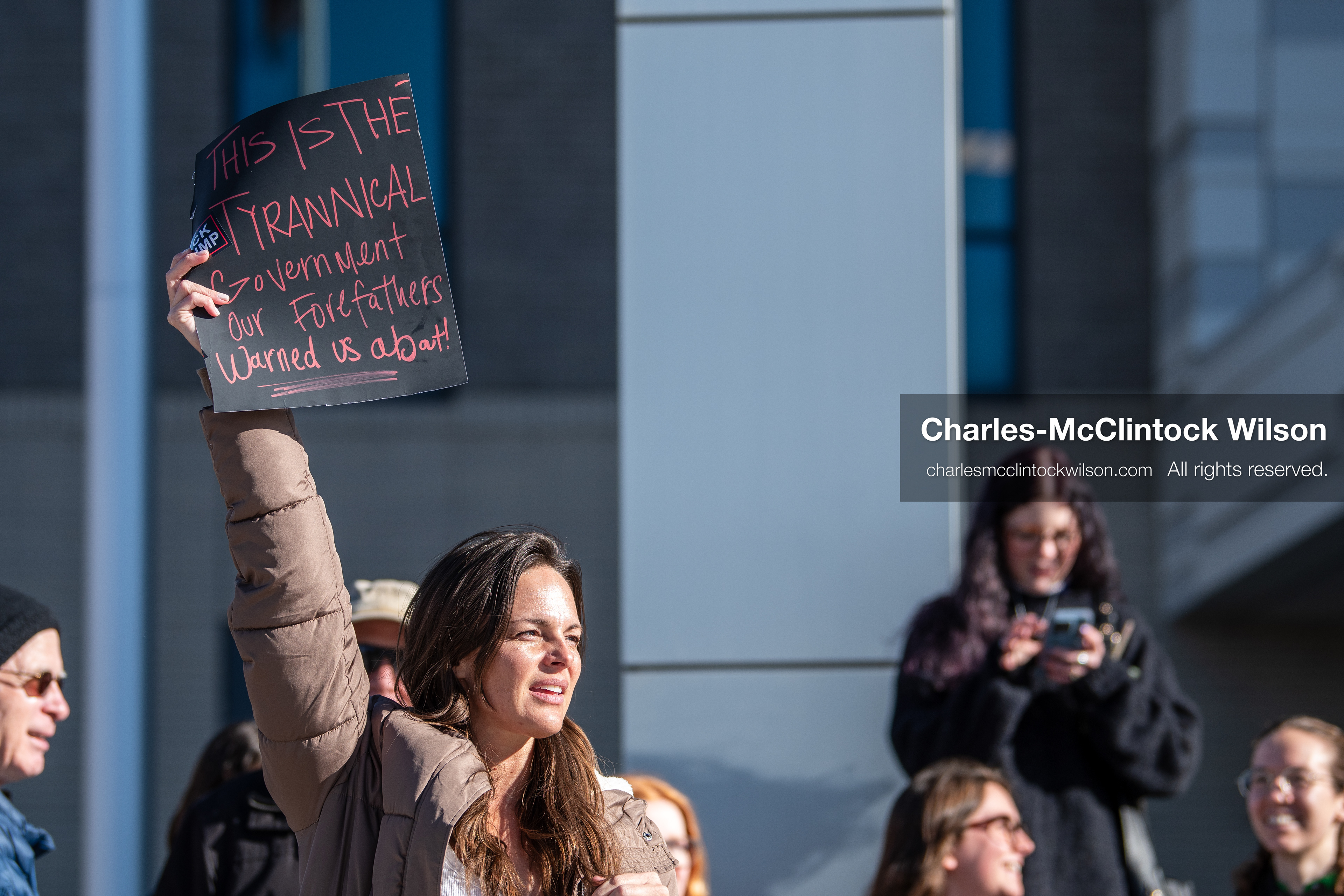 January 20, 2026, Provo, Utah, USA: A demonstrator stands outside Provo City Hall during the Free America Walkout protest in Provo Utah on January 20 2026. The nationwide event called for immigration reform and changes to detention practices. 