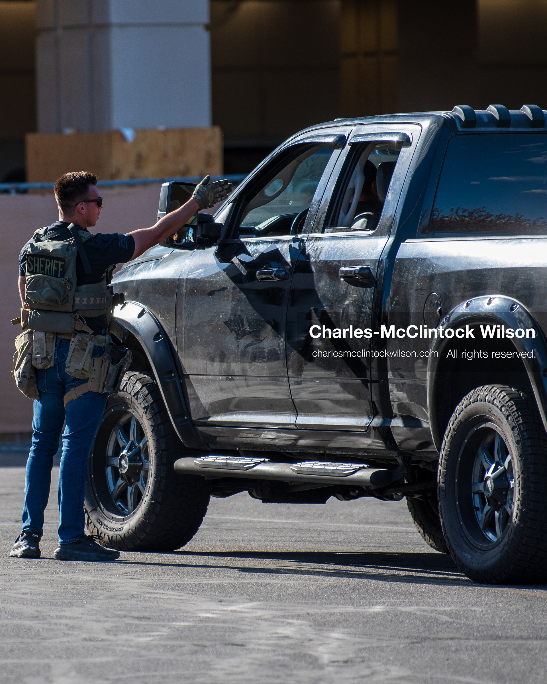 August 17, 2026, Murray, Utah, USA: A plainclothes law enforcement officer speaks with the driver of a pickup truck outside Intermountain Medical Center on Monday. Multiple police agencies secured the hospital perimeter as a safety precaution after shooting victims were brought in from a fatal shootout outside a funeral in nearby Kearns. (Credit Image: © Charles McClintock Wilson/ZUMA Press Wire)