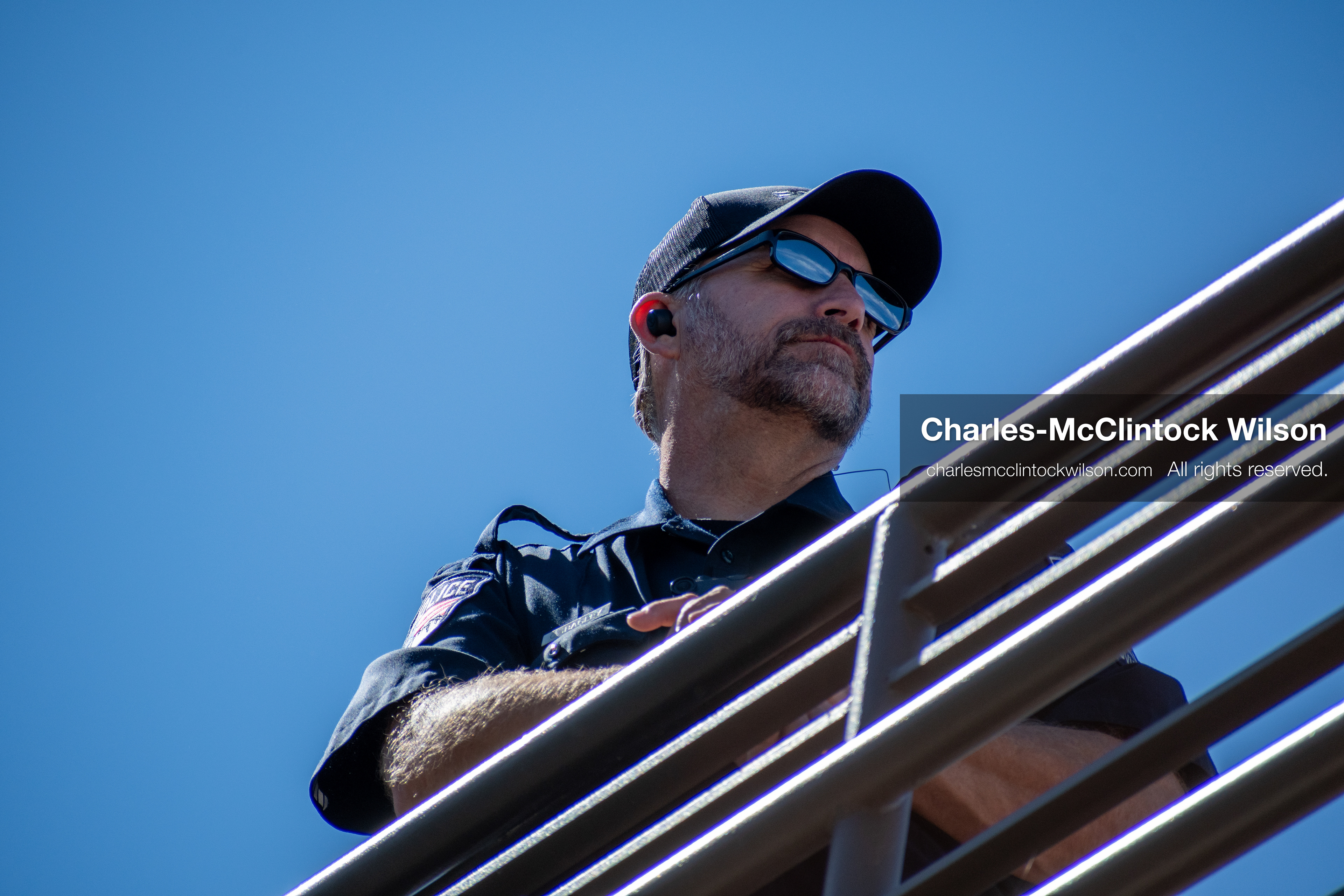 September 10, 2025 – Orem, Utah, United States: A Utah Valley University police officer maintains a security post on an elevated walkway ahead of a scheduled public event featuring conservative activist Charlie Kirk. Photograph by Charles‑McClintock Wilson / ZUMA Press Wire