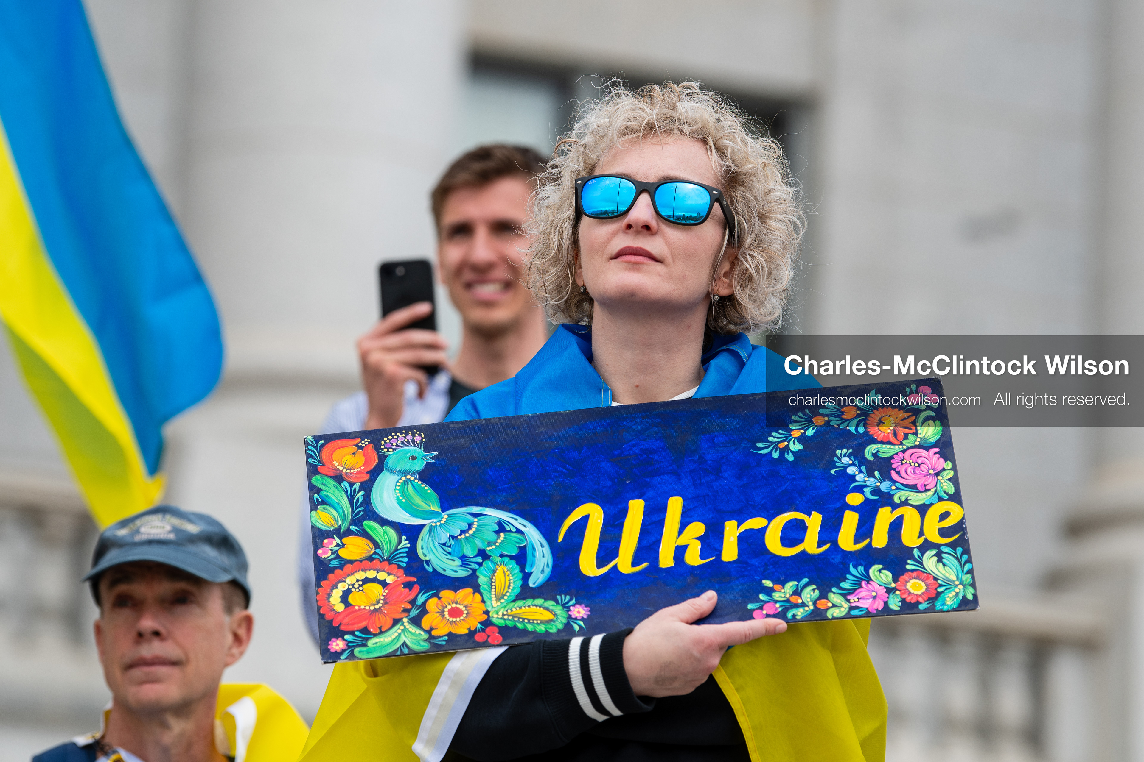 February 28, 2026, Salt Lake City, Utah, USA: A demonstrator draped in a Ukrainian flag holds a hand painted sign reading Ukraine during the Stand With Ukraine rally at the Utah State Capitol. The gathering marked the four year anniversary of the full scale Russian invasion of Ukraine and brought community members together in support of Ukrainians and local humanitarian efforts. (Credit Image: © Charles McClintock Wilson/ZUMA Press Wire)