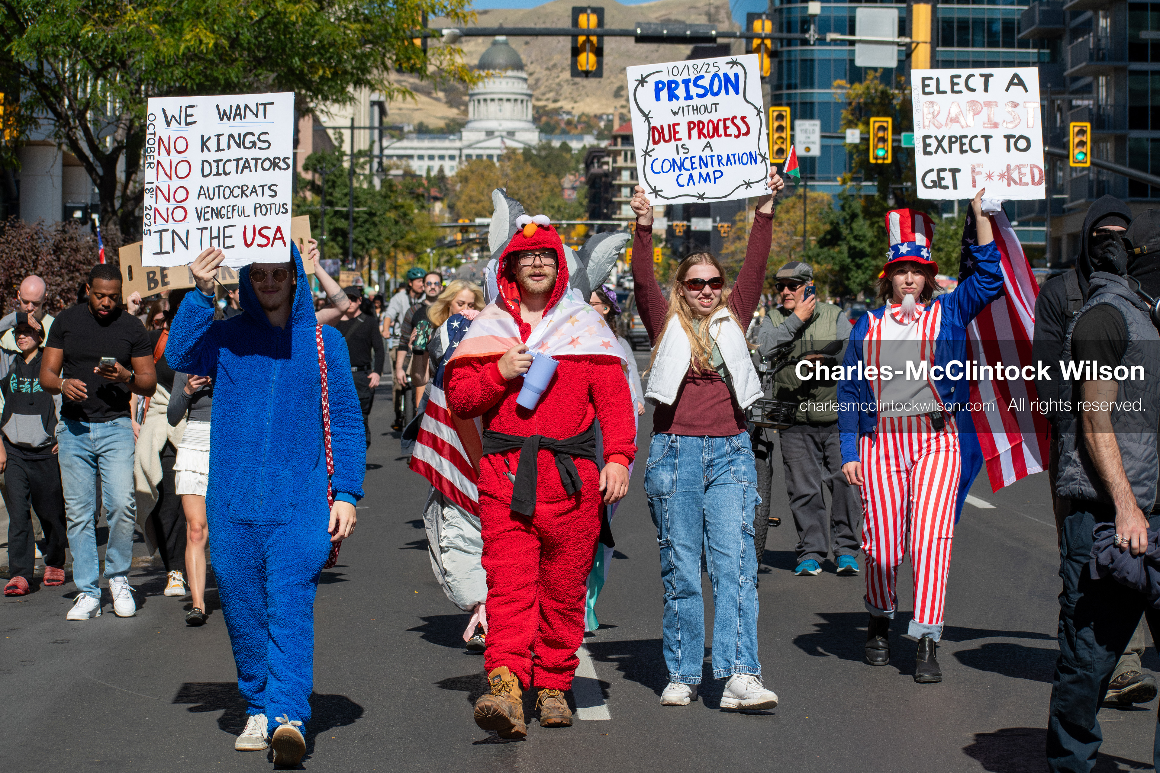 October 18, 2025, Salt Lake City, Utah, USA: Demonstrators march along South State Street during a "No Kings" protest in Salt Lake City, Utah. The protest was part of a nationwide mobilization.