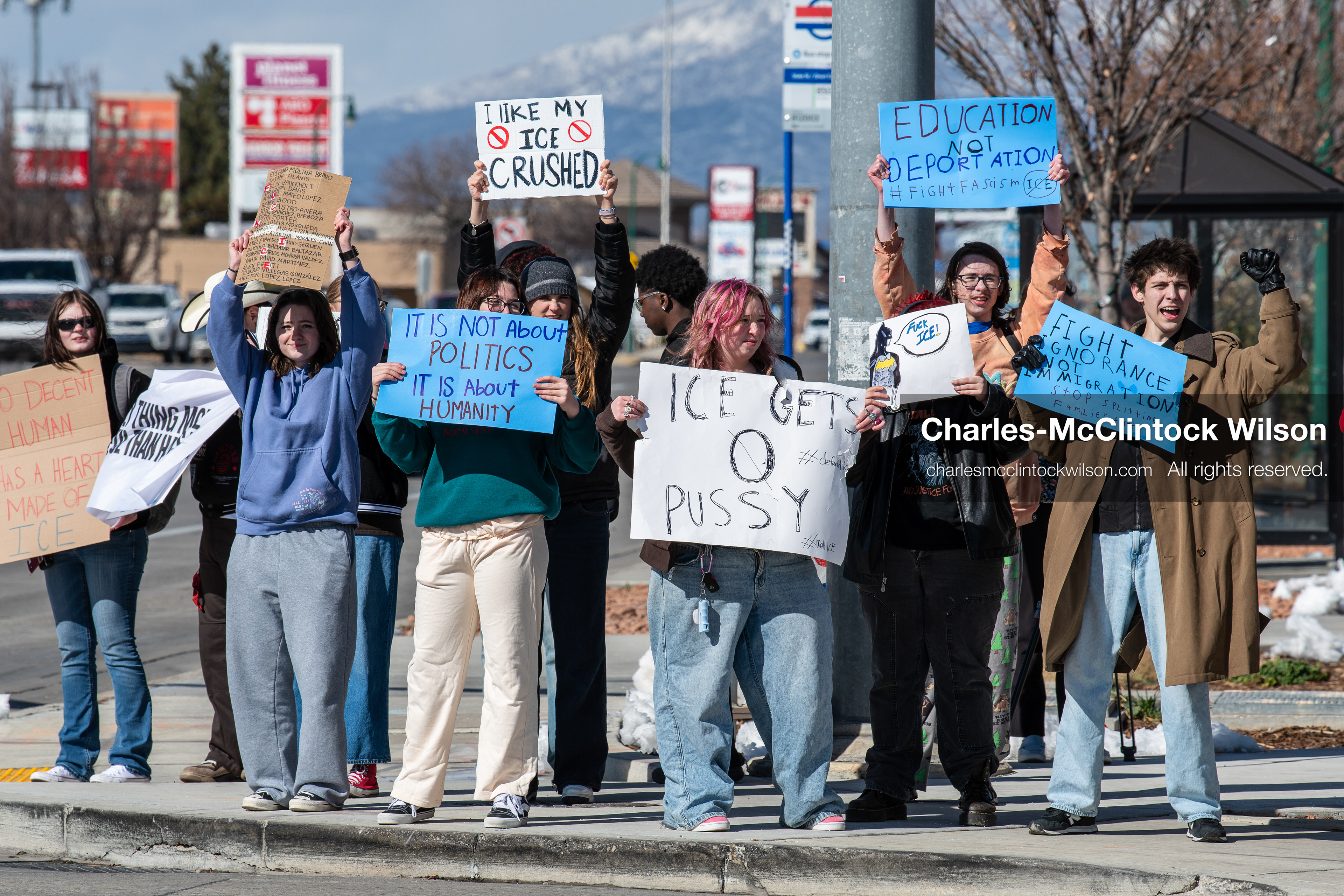February 20, 2026, Orem, Utah, USA: High school students gather along State Street in front of Orem City Hall during a student led protest against ICE and federal immigration enforcement. Demonstrators hold signs as they stand near the roadway while traffic continues through the area. (Credit Image: © Charles McClintock Wilson/ZUMA Press Wire)