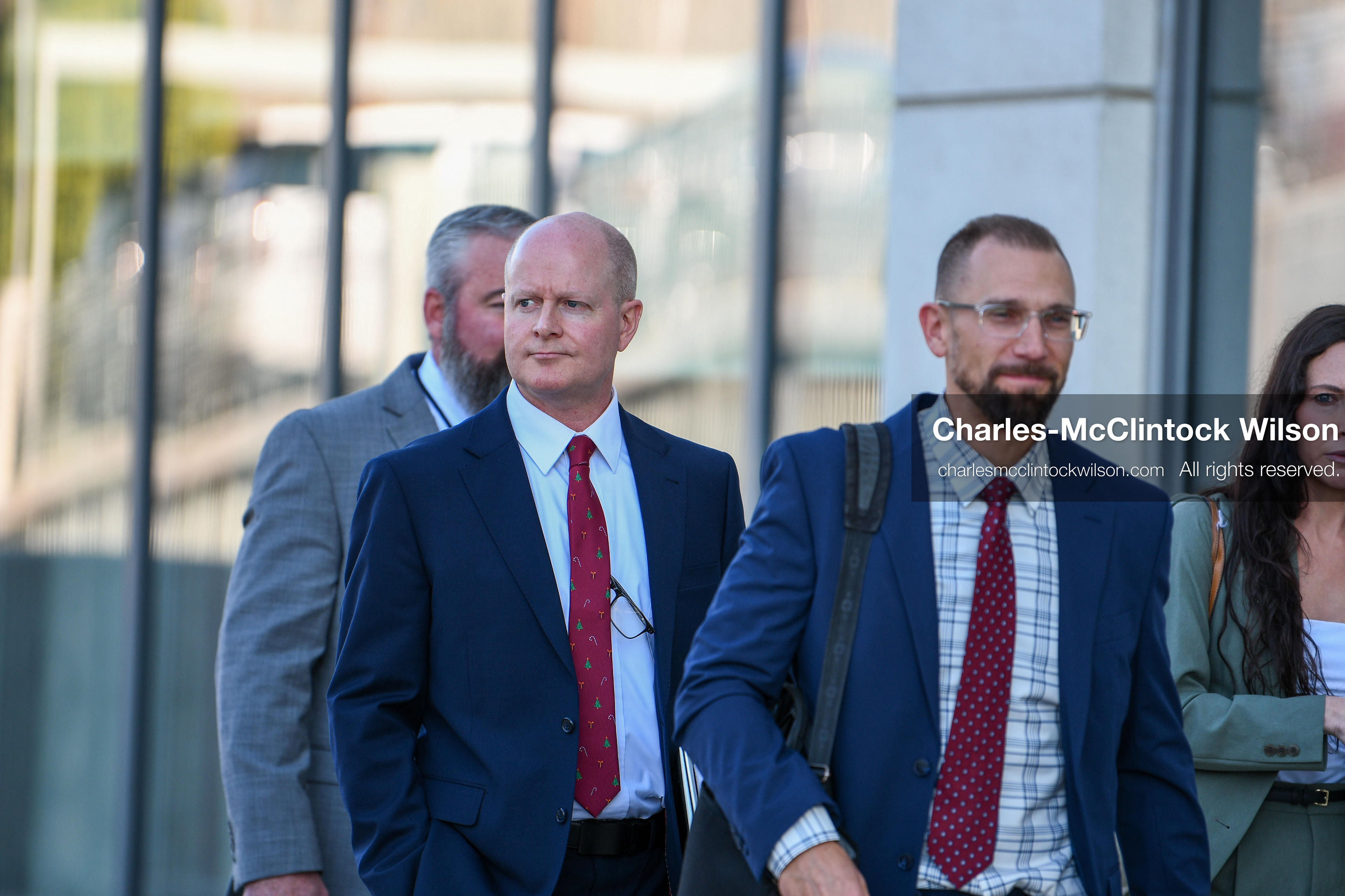PROVO, UTAH, USA – DECEMBER 11, 2025: Chad Grunander, center, a prosecutor with the Utah County Attorney’s Office, arrives at the Fourth District Court in Provo for the first in‑person court appearance of Tyler Robinson in the Charlie Kirk murder case. (Credit Image: © Charles‑McClintock Wilson/ZUMA Press Wire)